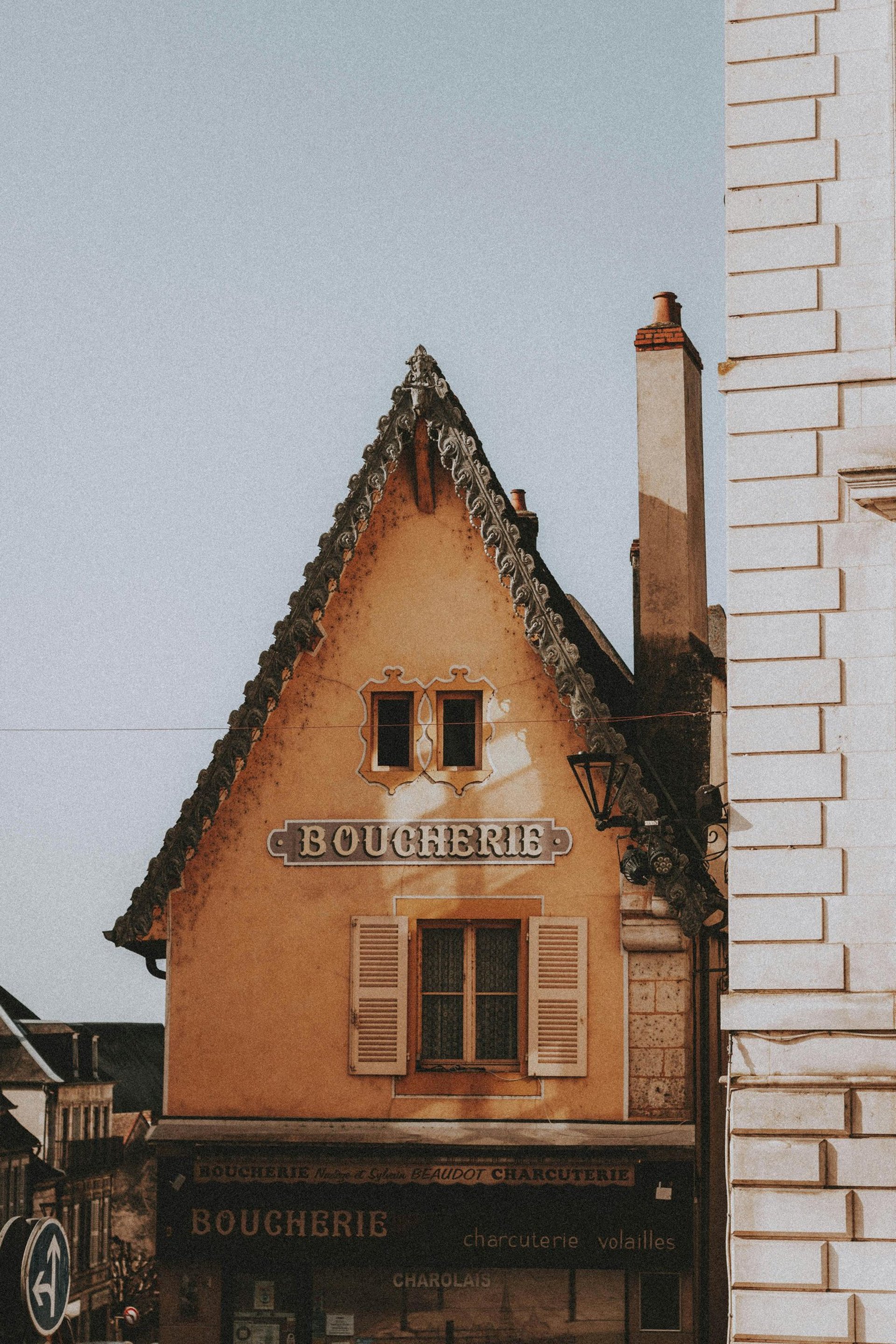 an abstract photo of a curved building with a blue sky in the background