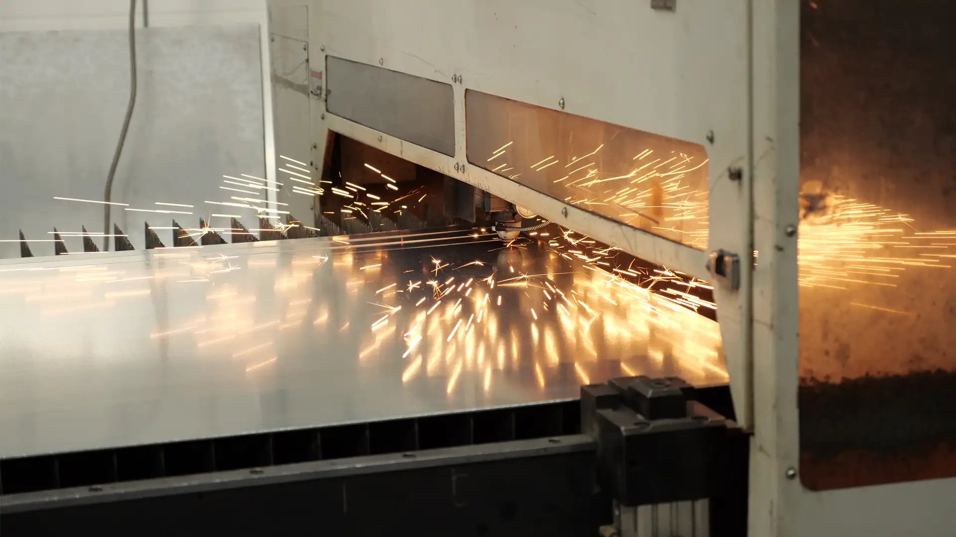 Laser sparks from precision cutting of sheet metal.