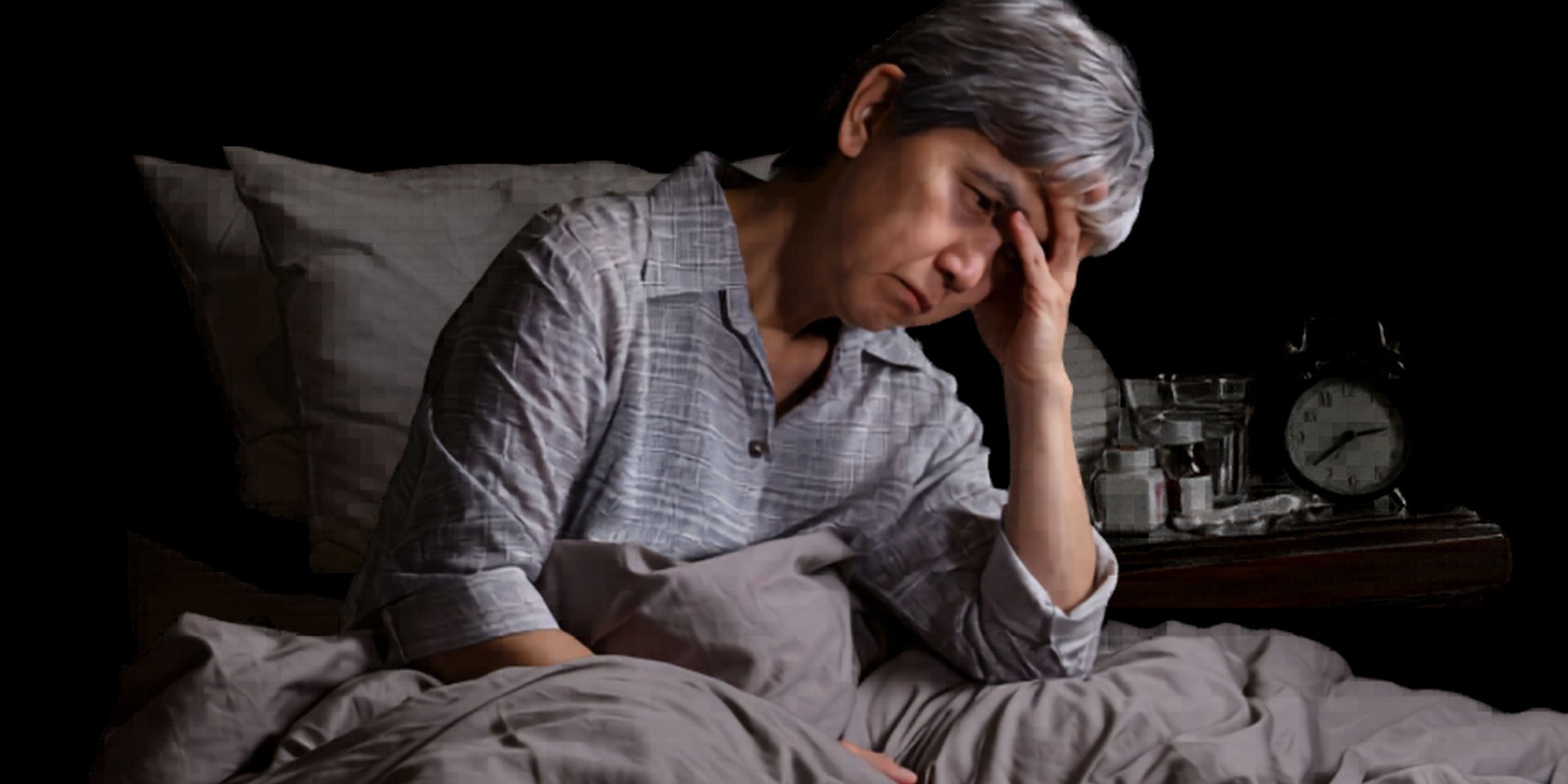 silhouette of man sitting on rock during sunset