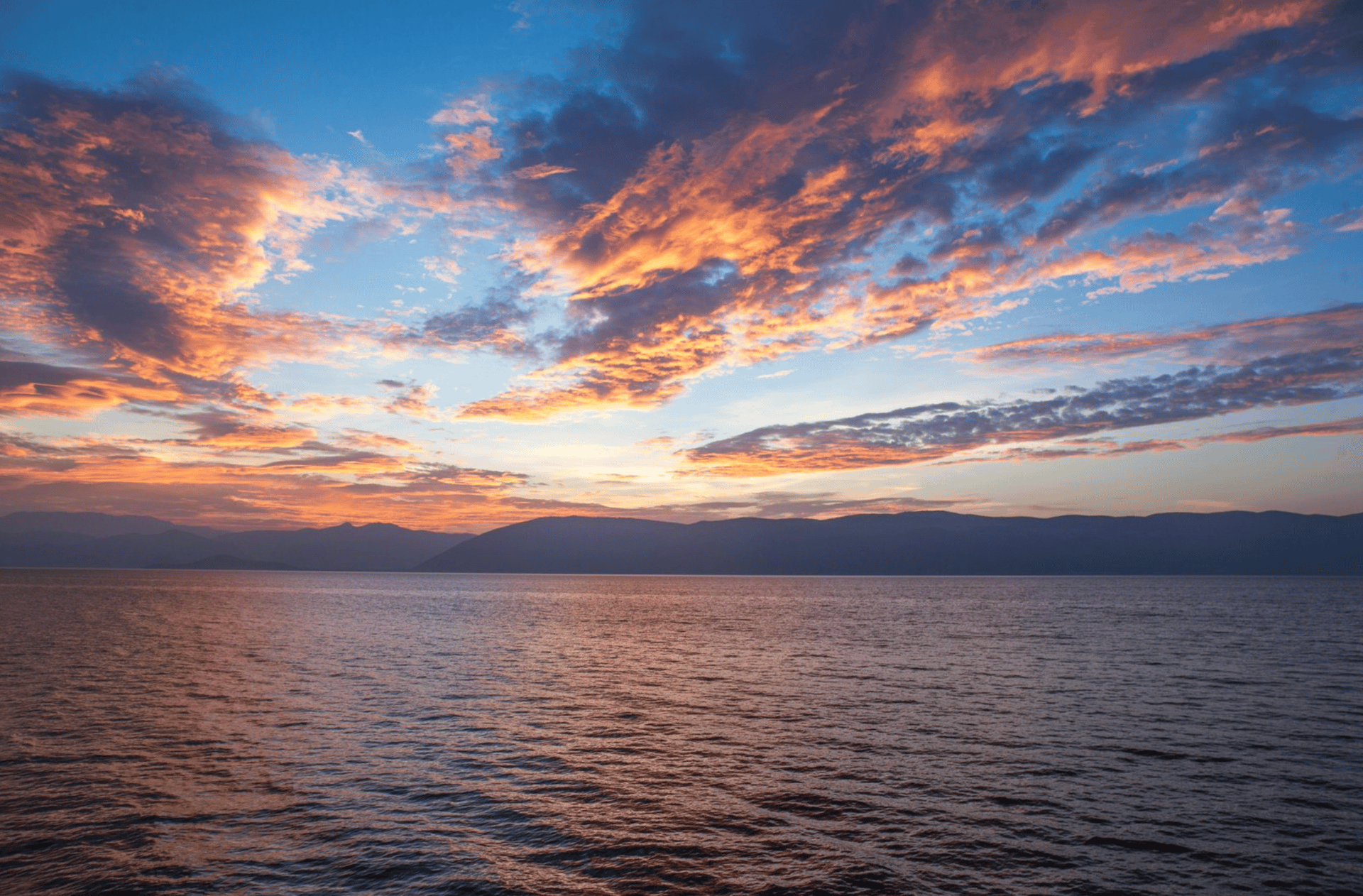 calm body of water during golden hour