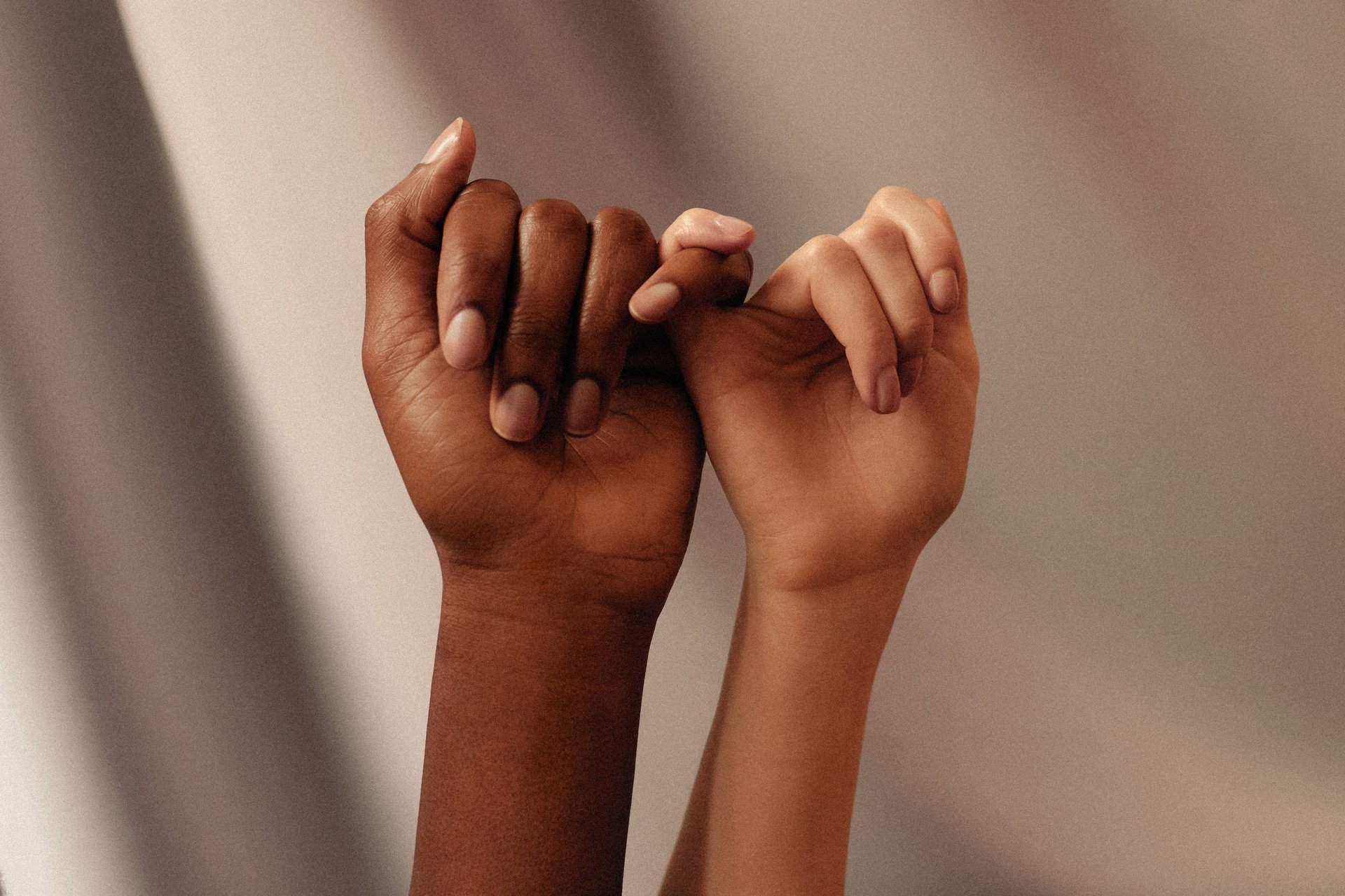 two hands about to hold wallpaper