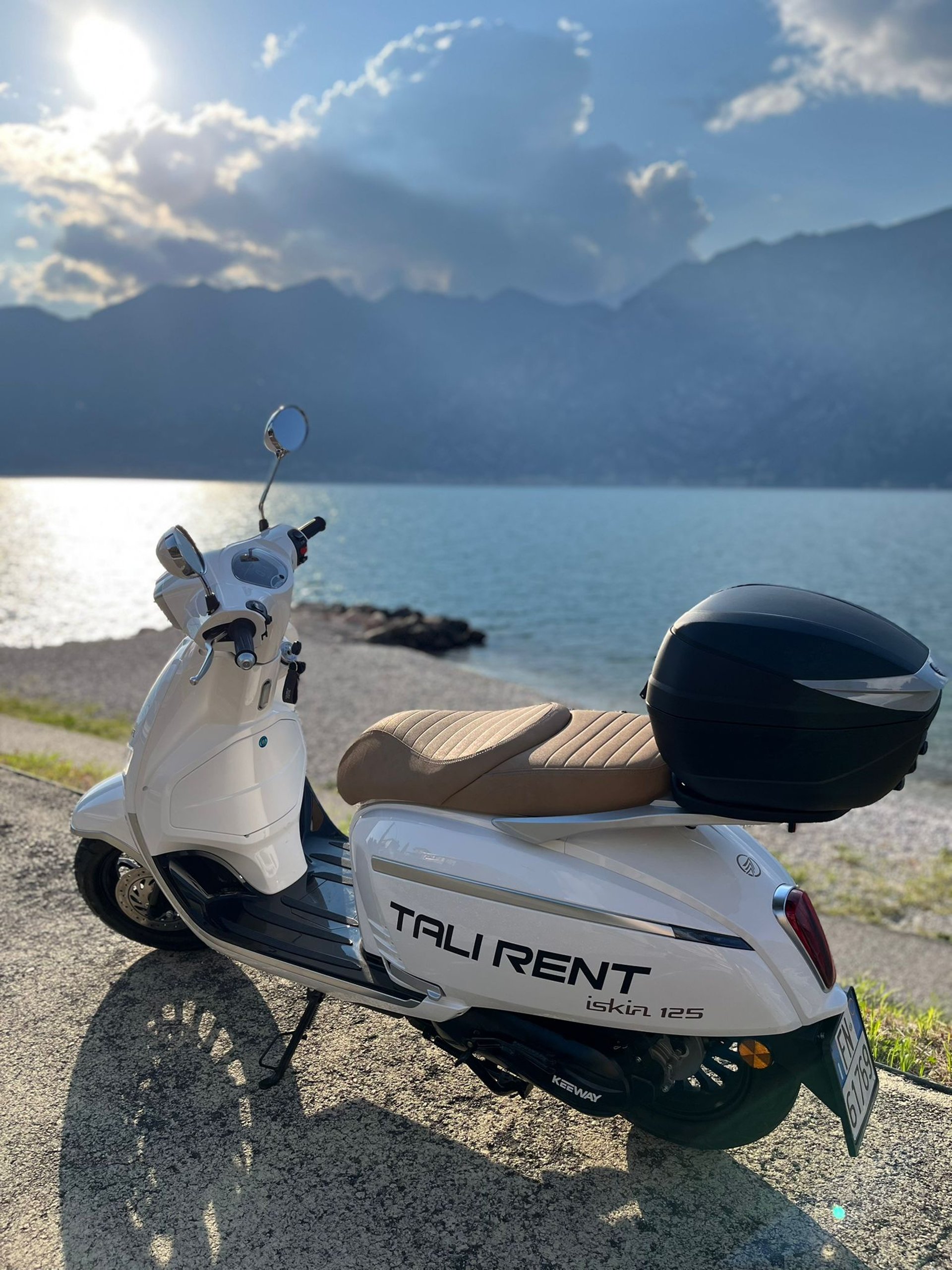 woman wearing yellow long-sleeved dress under white clouds and blue sky during daytime