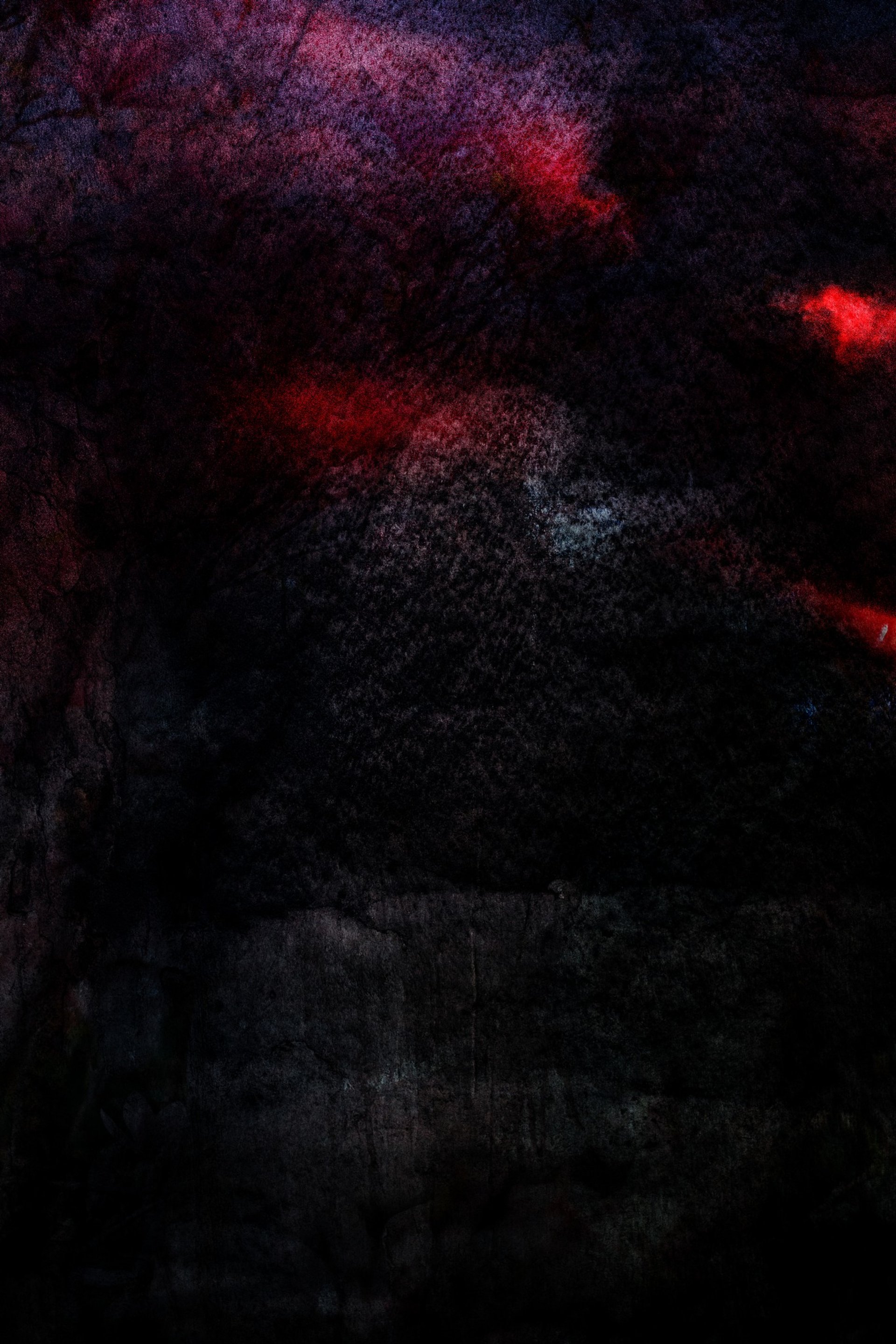 an abstract photo of a curved building with a blue sky in the background