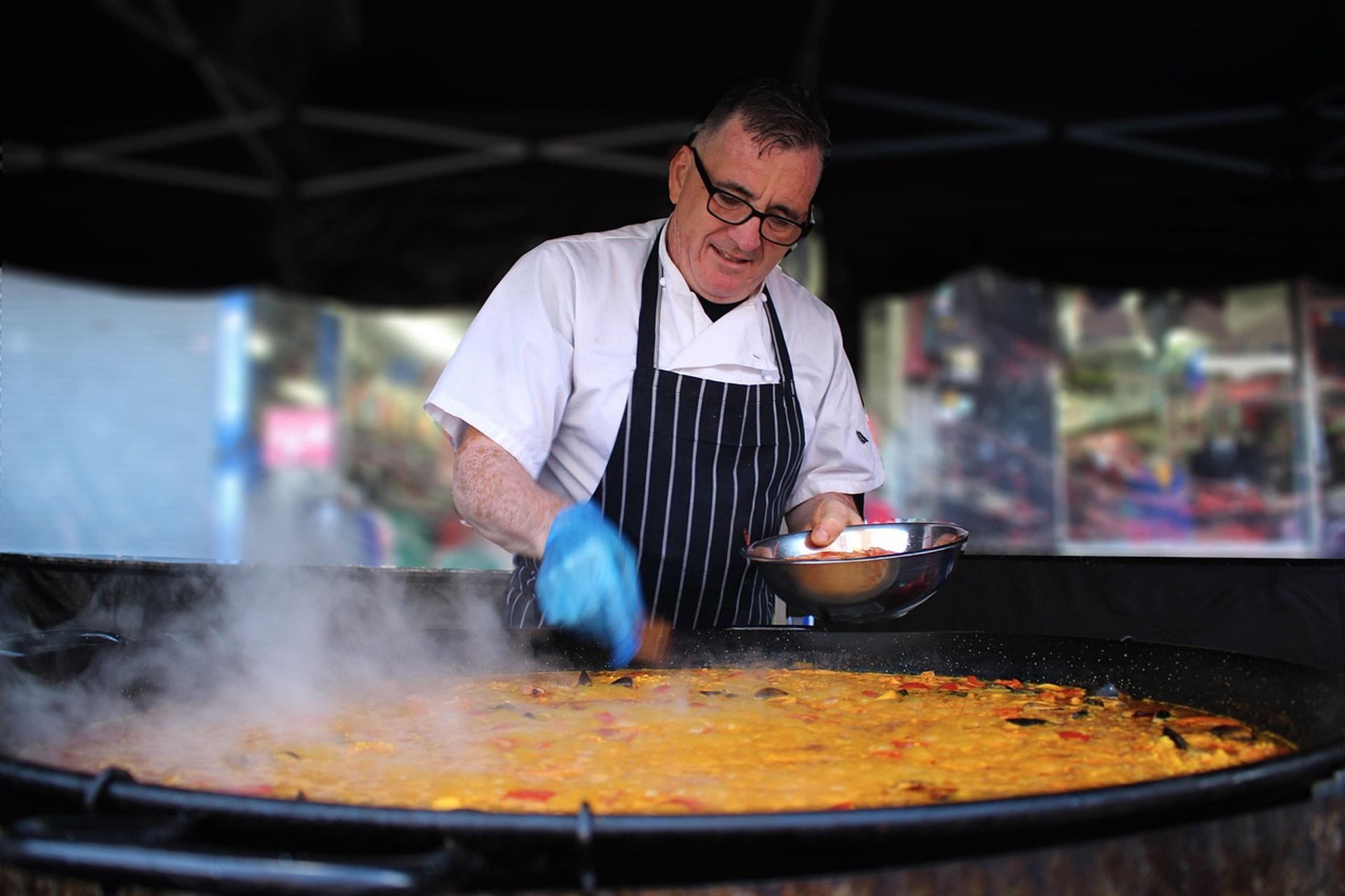 chef cooking a big paella
