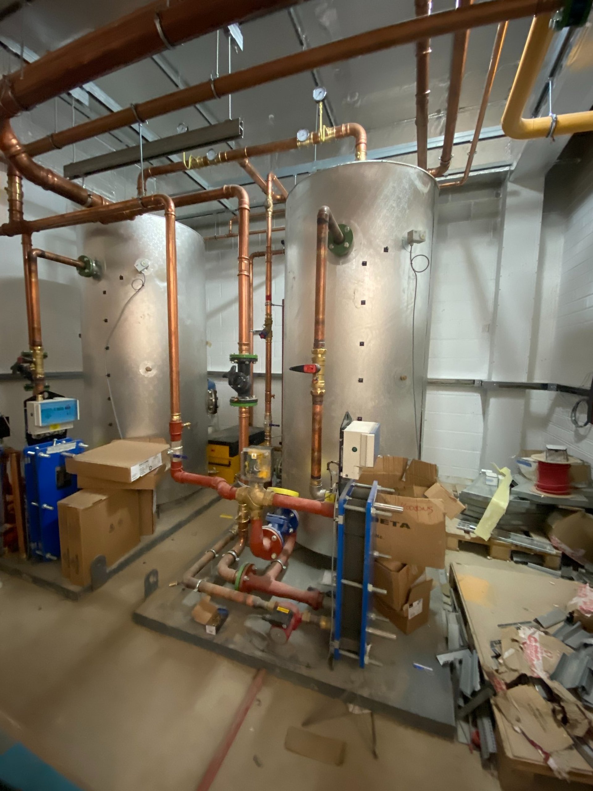 an abstract photo of a curved building with a blue sky in the background