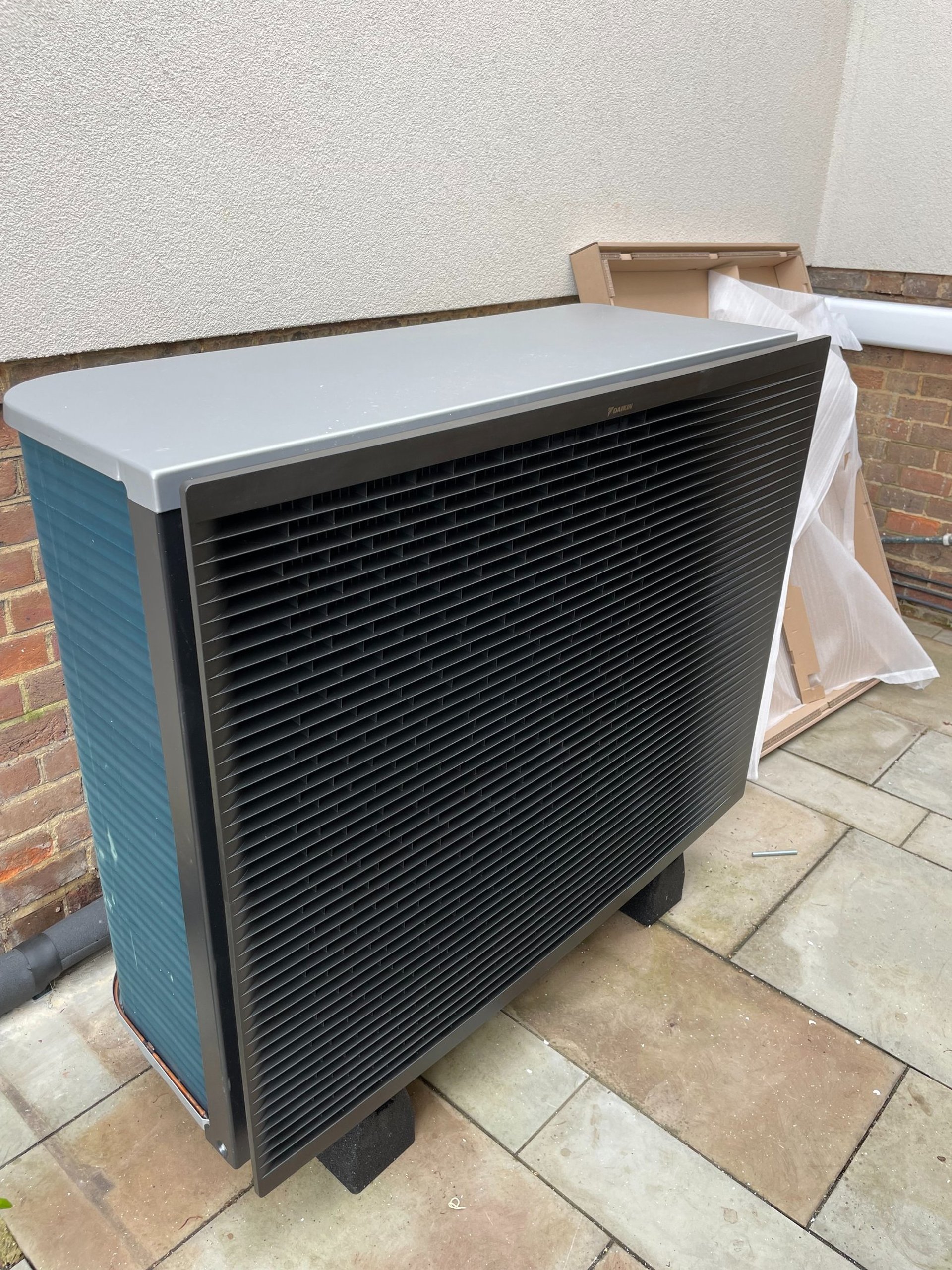 an abstract photo of a curved building with a blue sky in the background