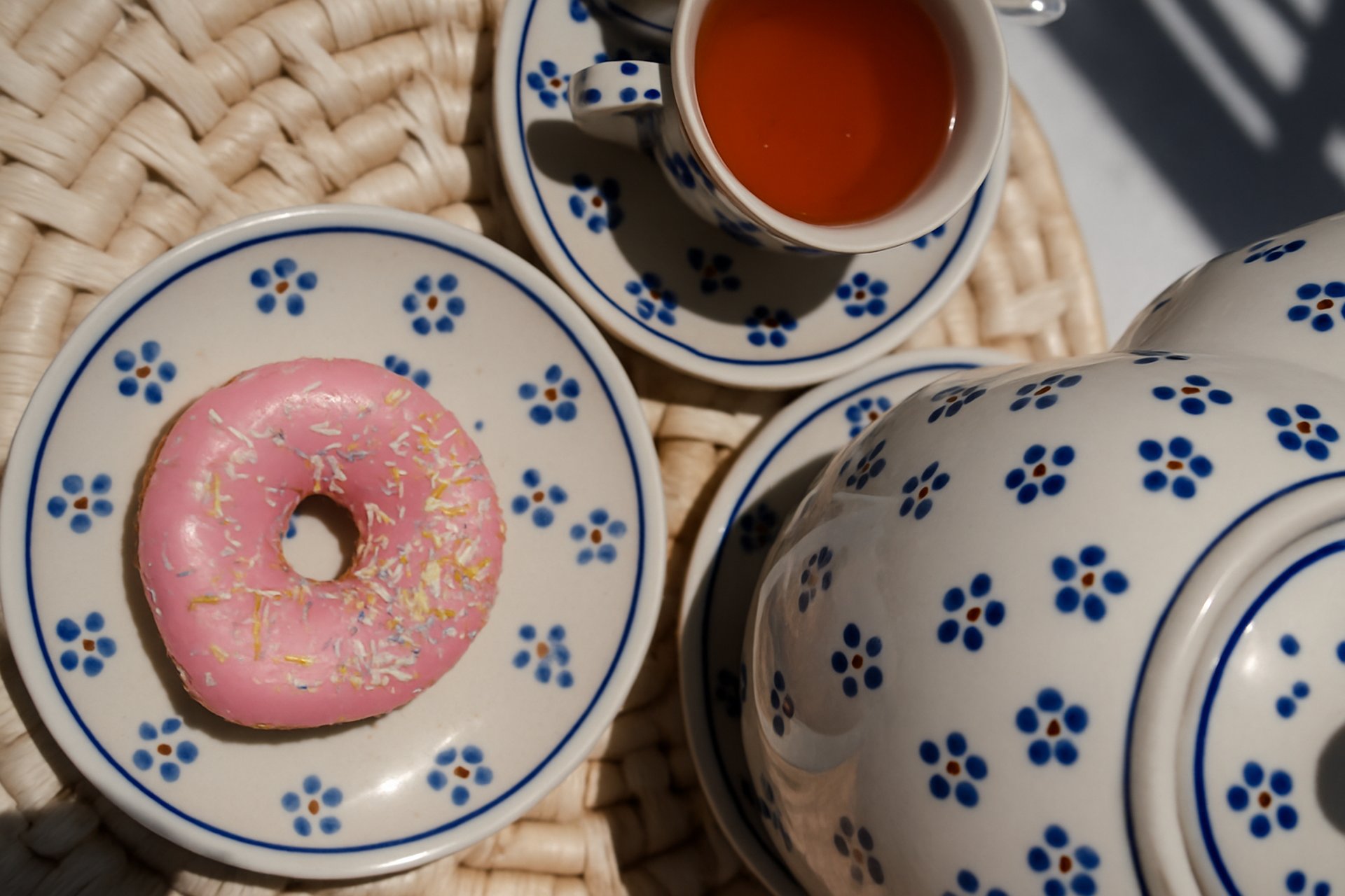 brown rocky mountain beside body of water during daytime