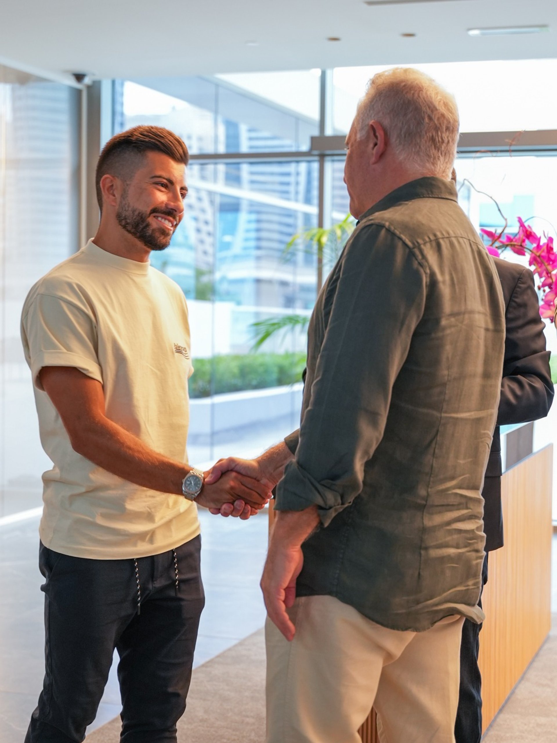 an abstract photo of a curved building with a blue sky in the background