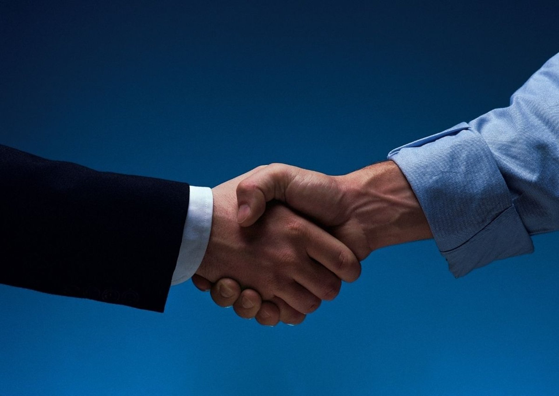 woman wearing yellow long-sleeved dress under white clouds and blue sky during daytime