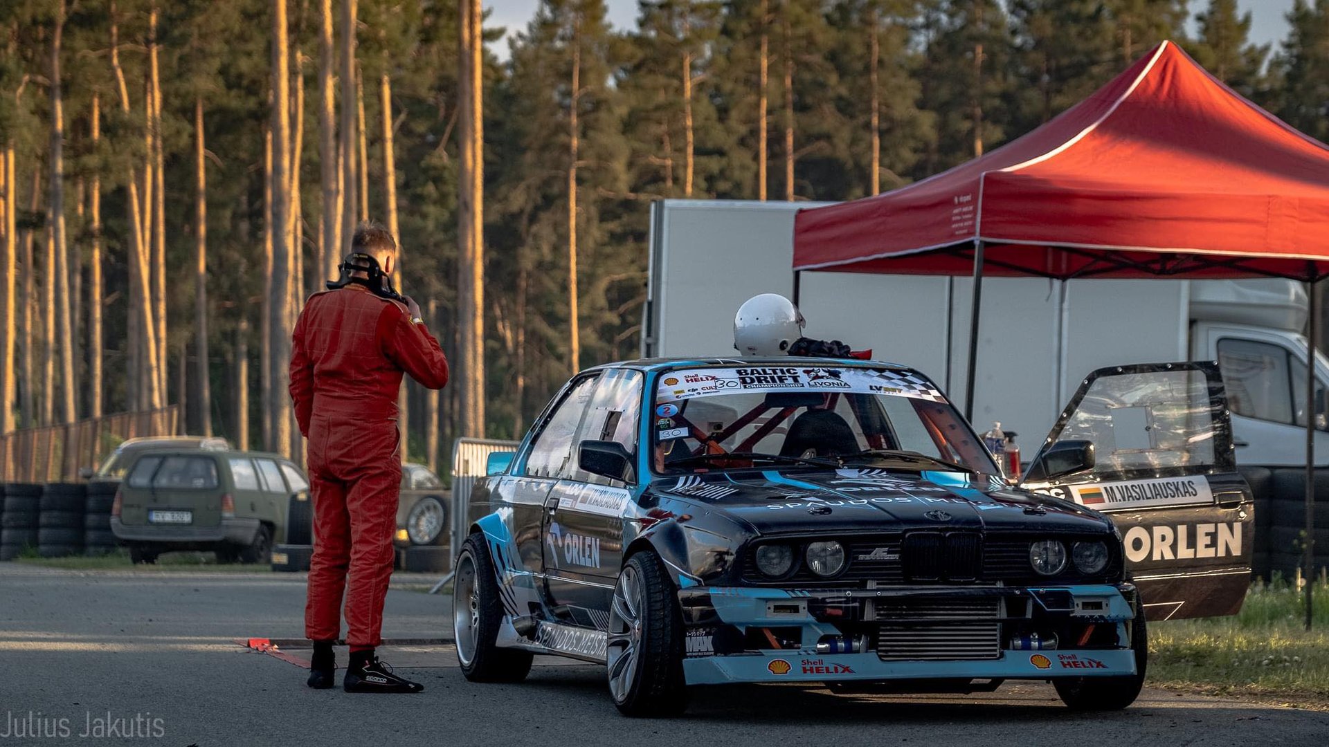 an abstract photo of a curved building with a blue sky in the background