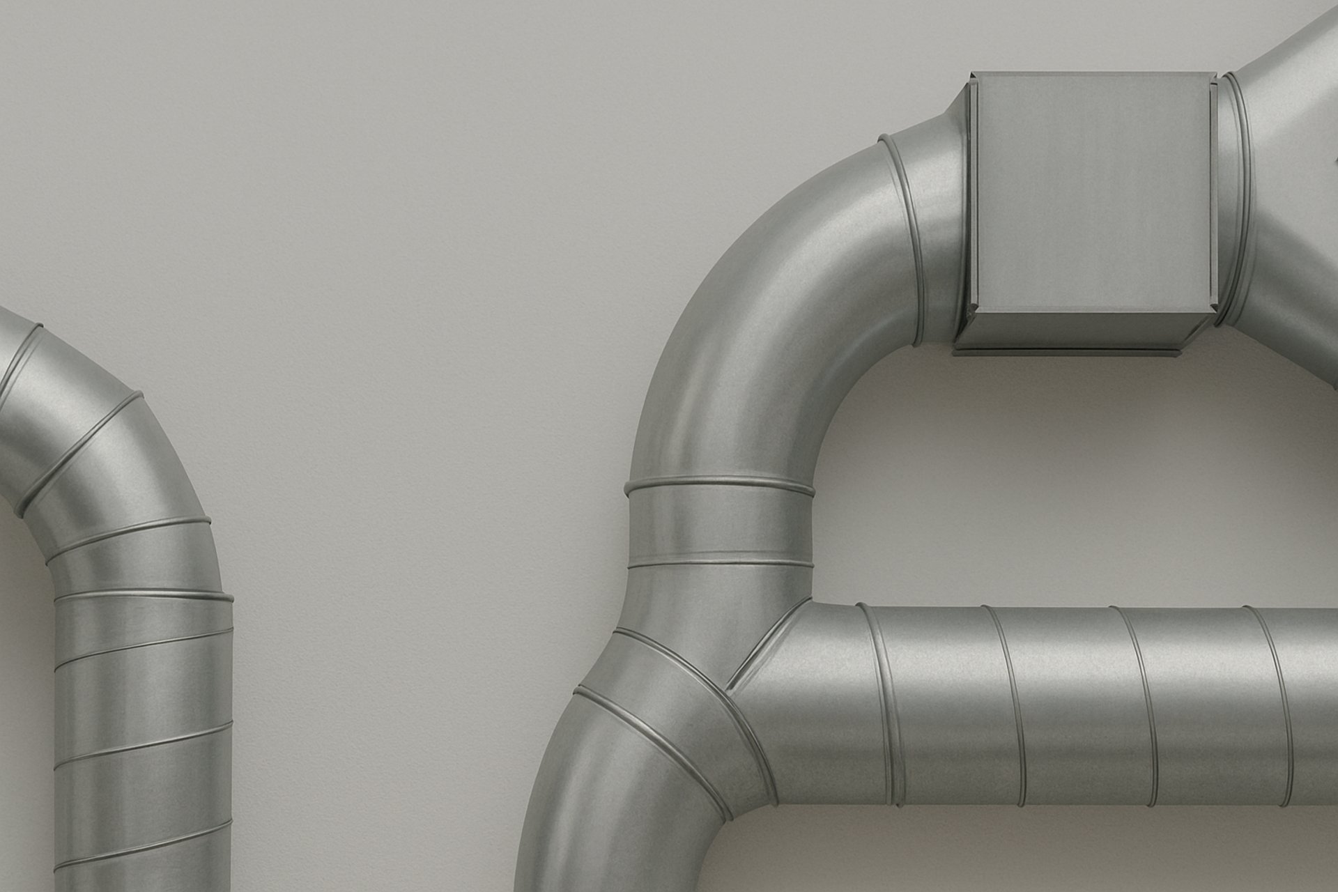 a room with a lot of pipes hanging from the ceiling