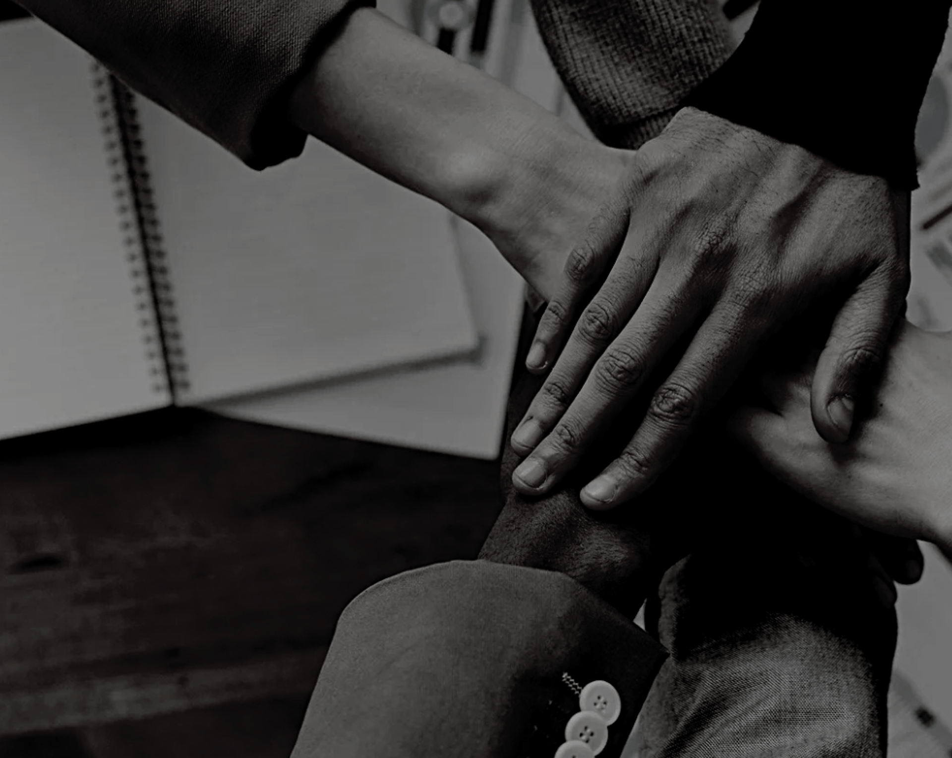 two women bending while holding hands