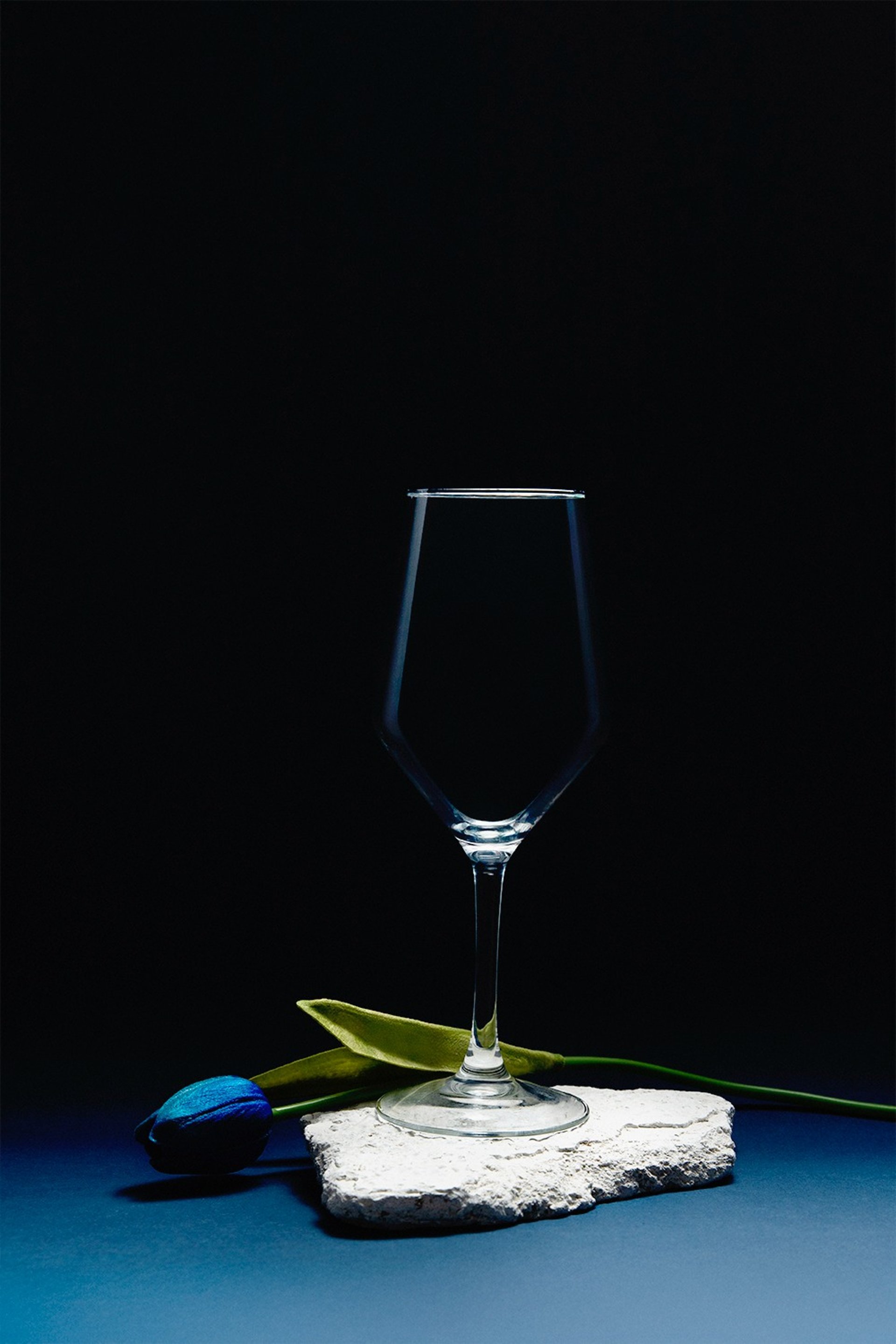 an abstract photo of a curved building with a blue sky in the background