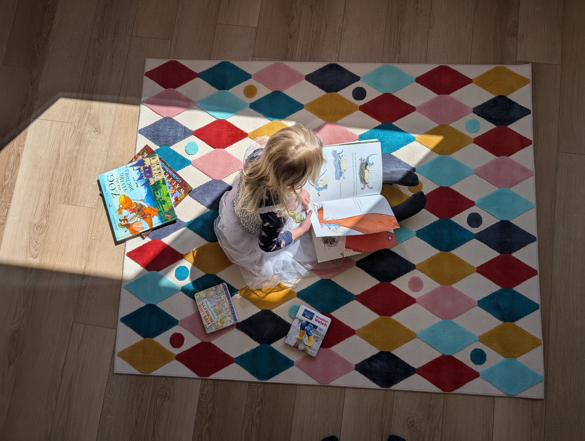 three crumpled yellow papers on green surface surrounded by yellow lined papers