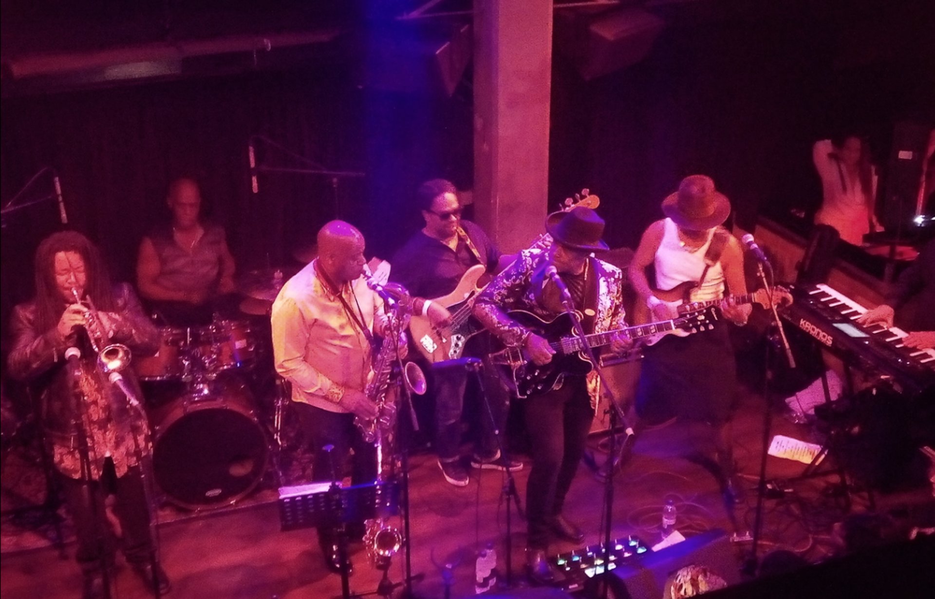 an abstract photo of a curved building with a blue sky in the background