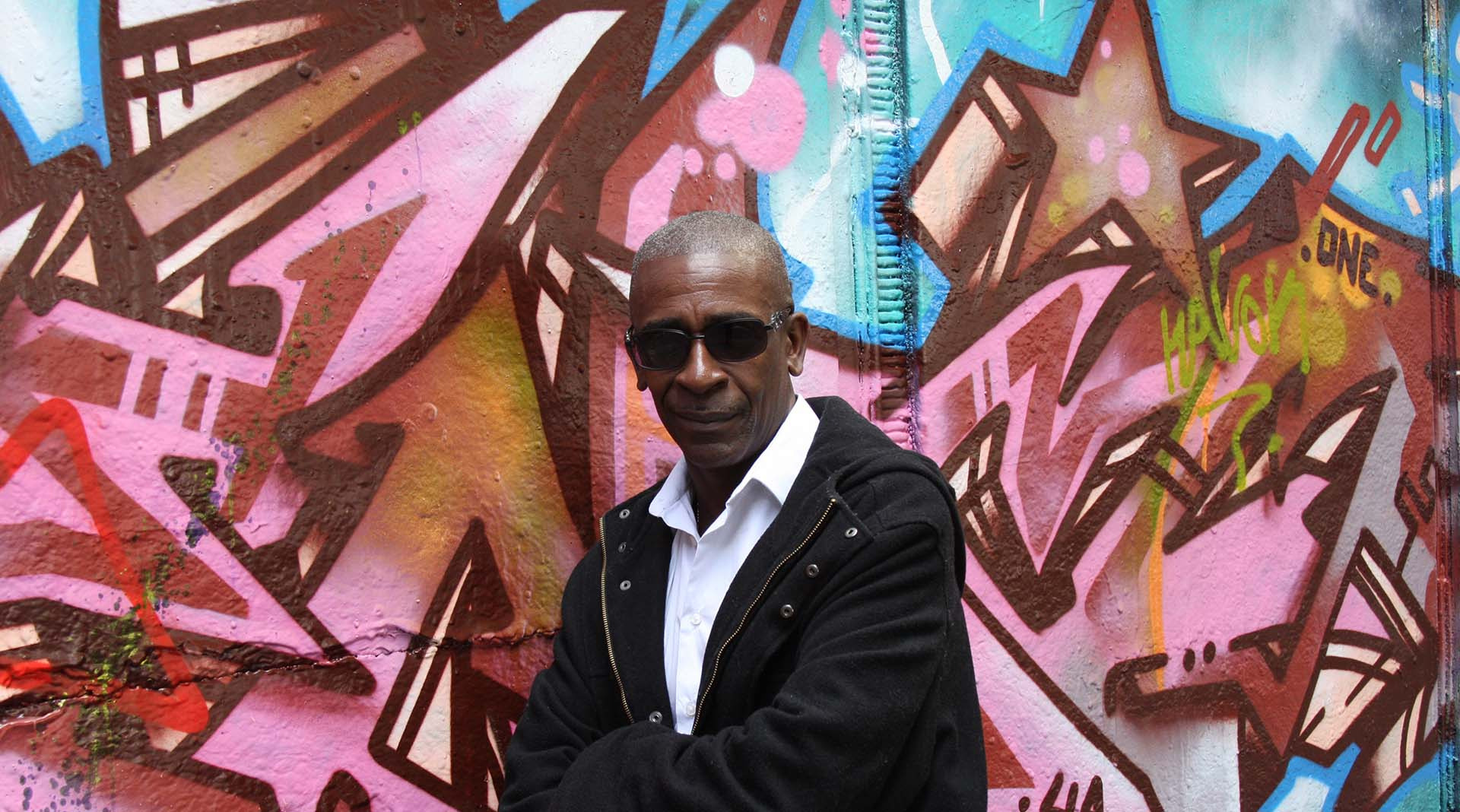 an abstract photo of a curved building with a blue sky in the background