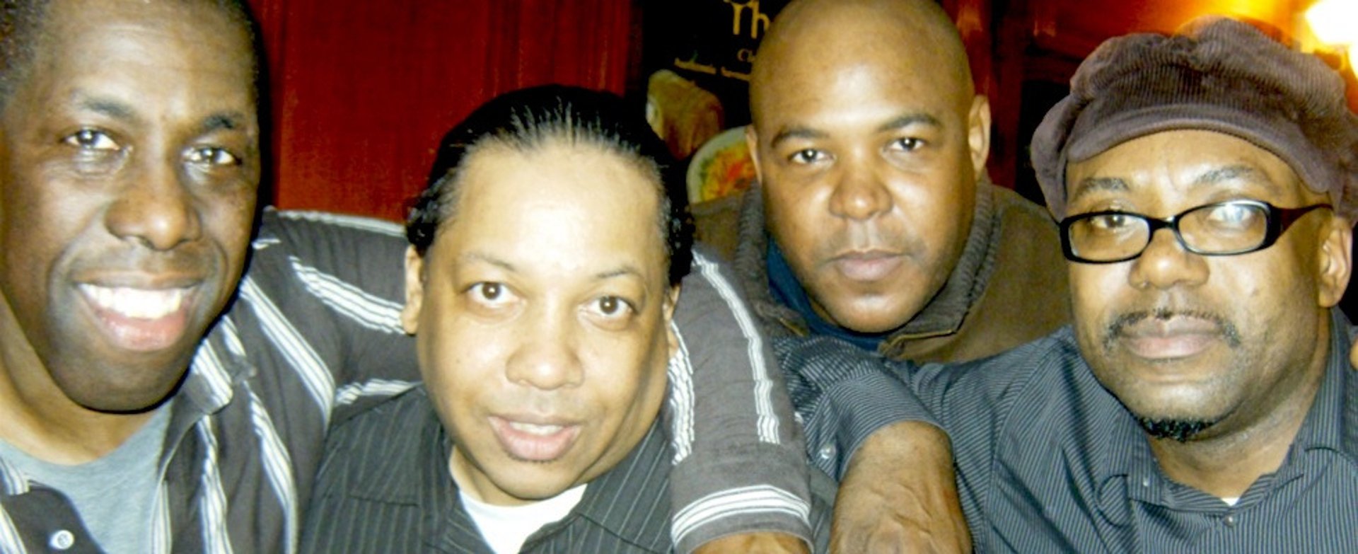 an abstract photo of a curved building with a blue sky in the background