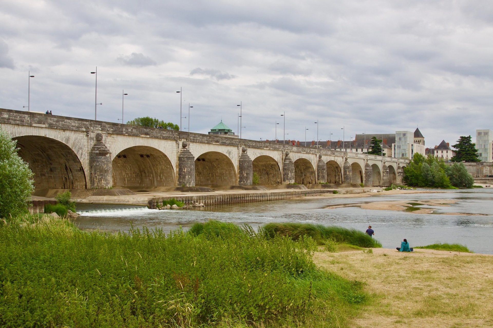 brown wooden table beside gray couch
