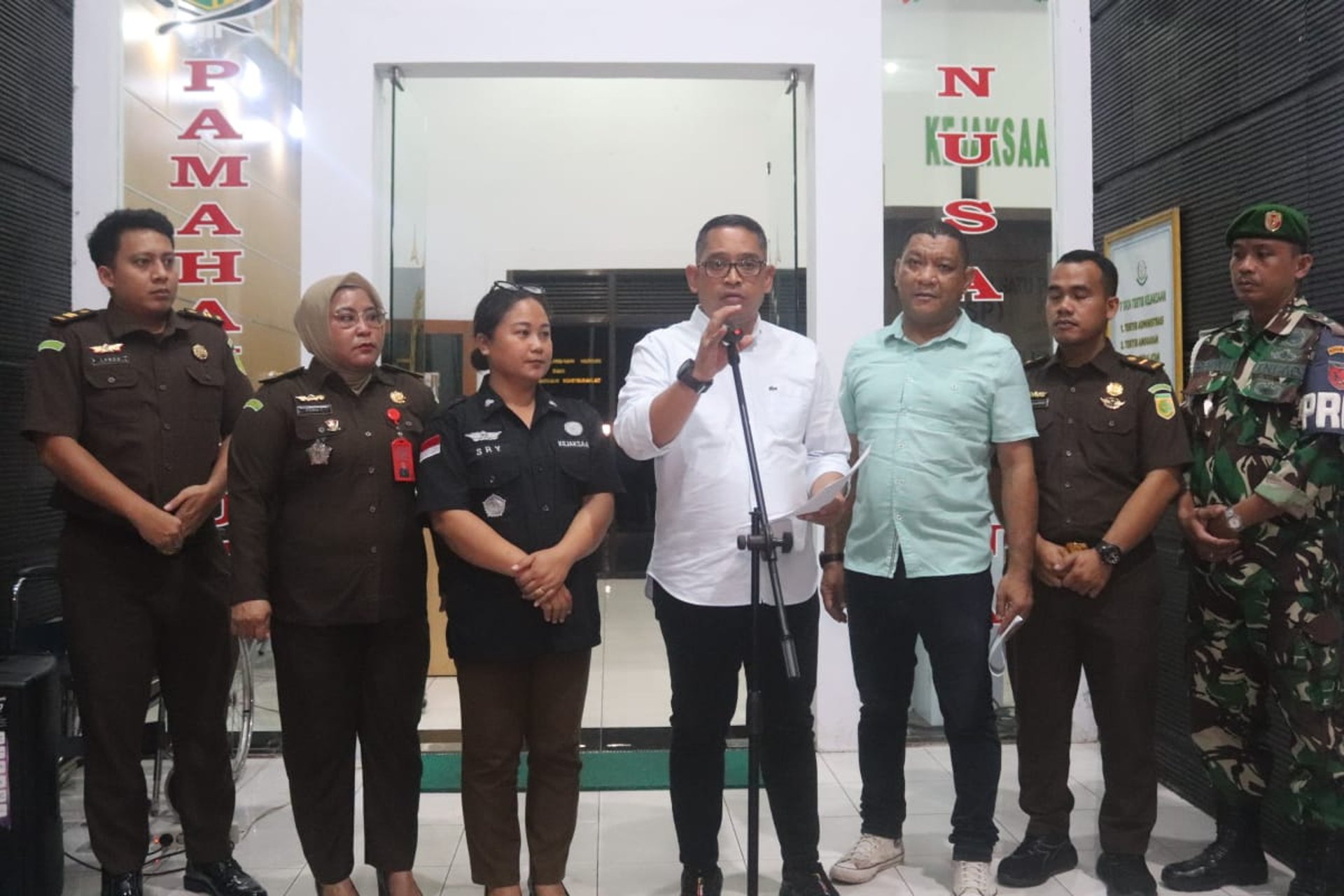 an abstract photo of a curved building with a blue sky in the background