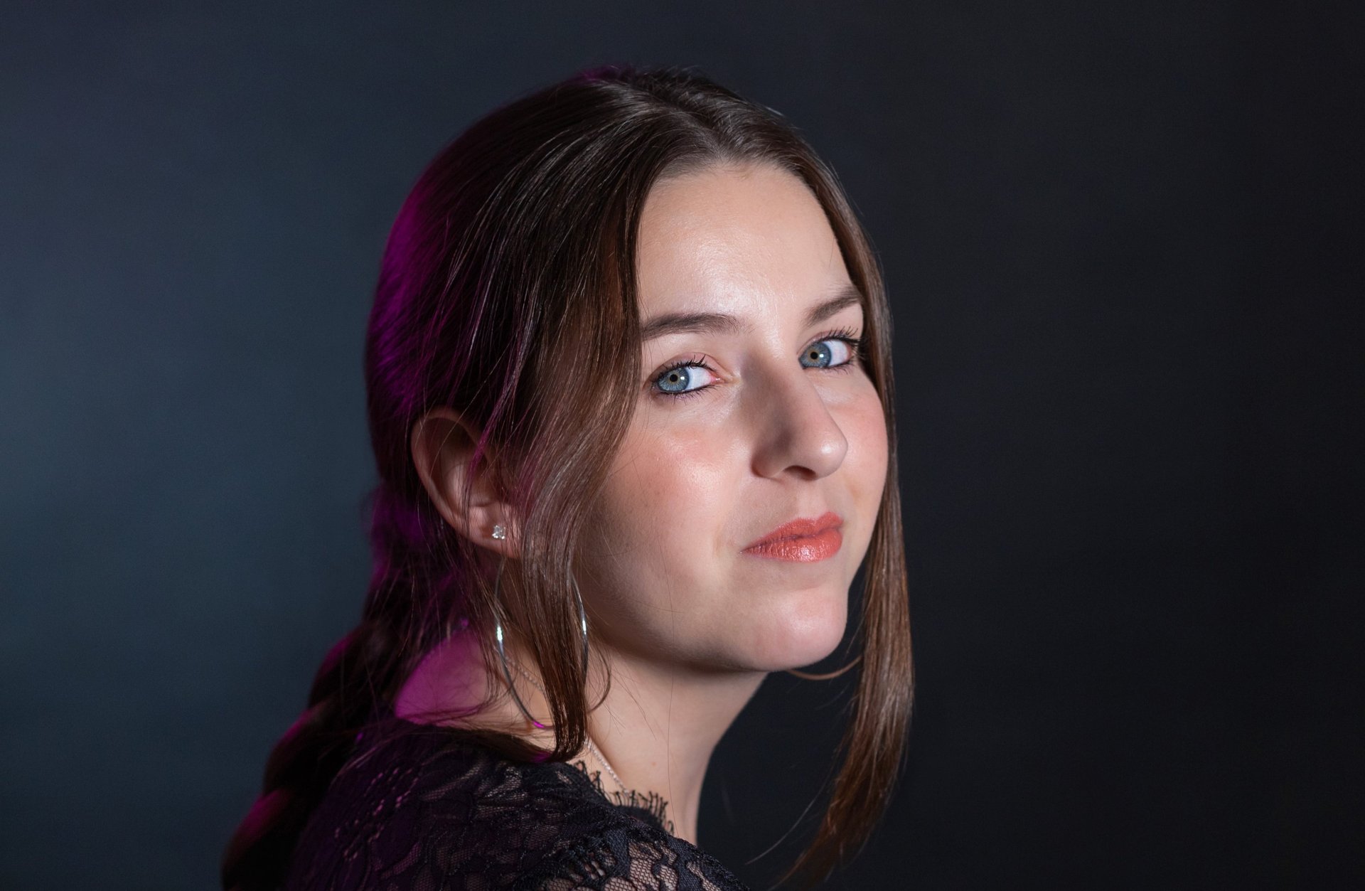 an abstract photo of a curved building with a blue sky in the background