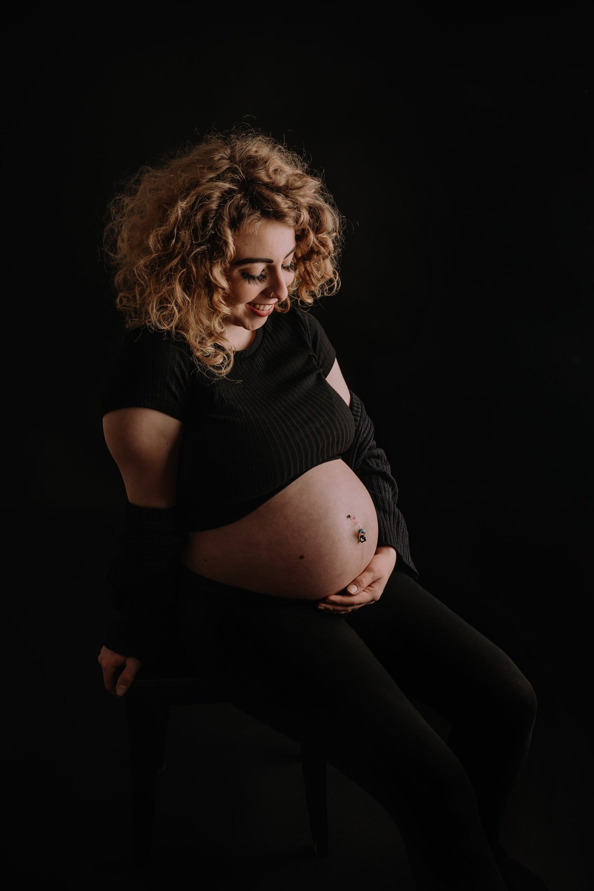 an abstract photo of a curved building with a blue sky in the background