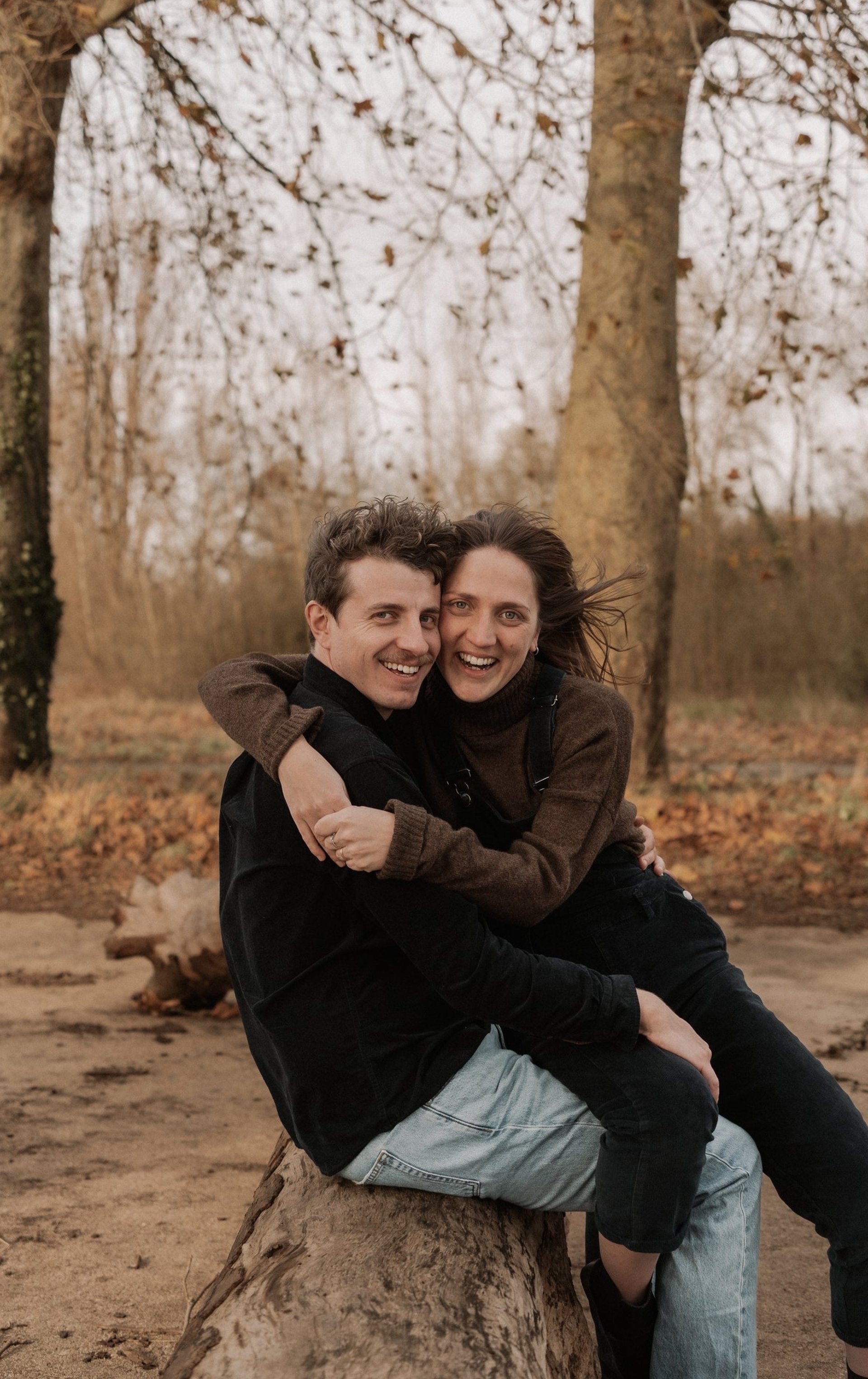 man and woman standing on wooden platform