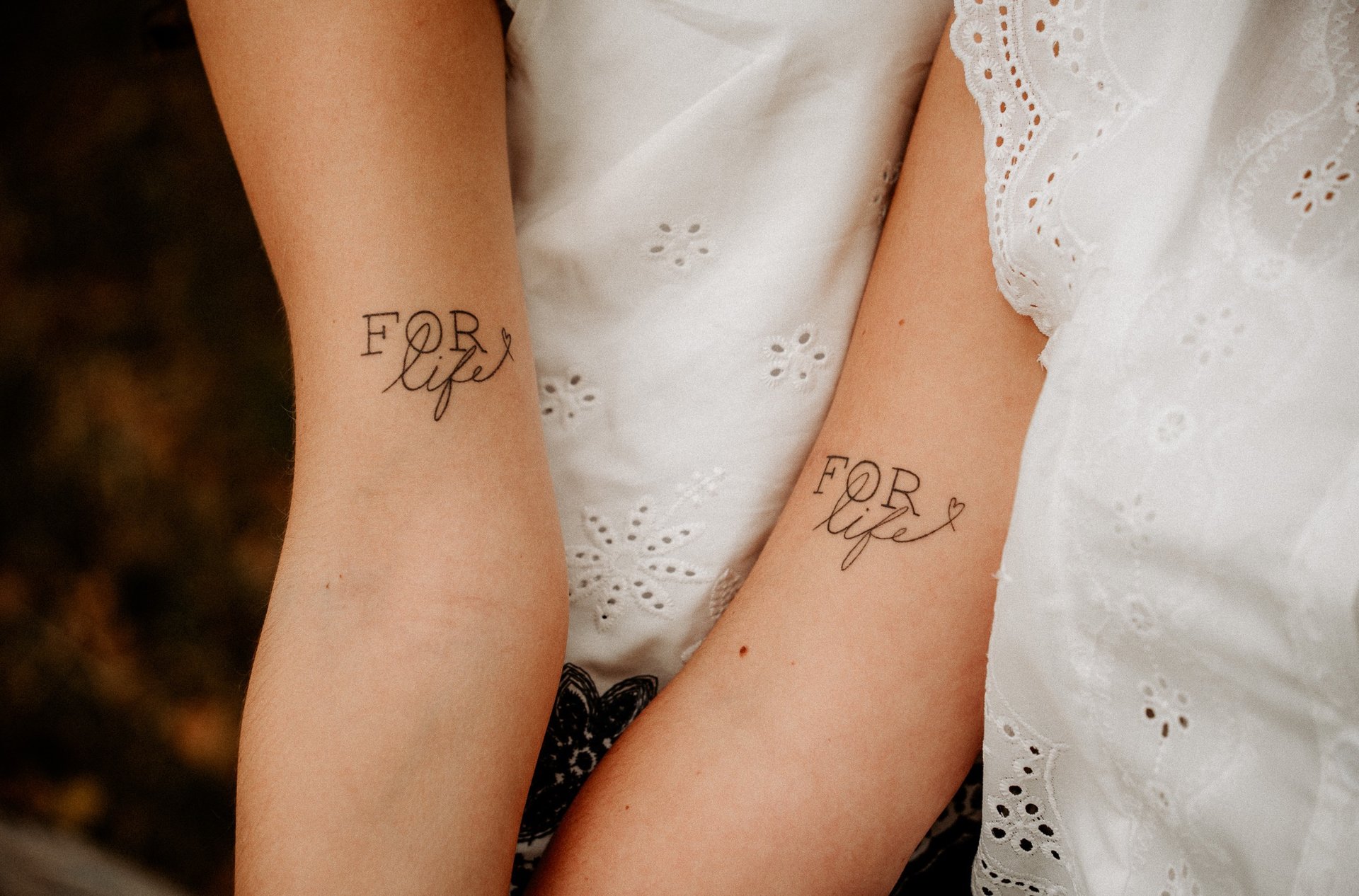 man and woman standing on wooden platform