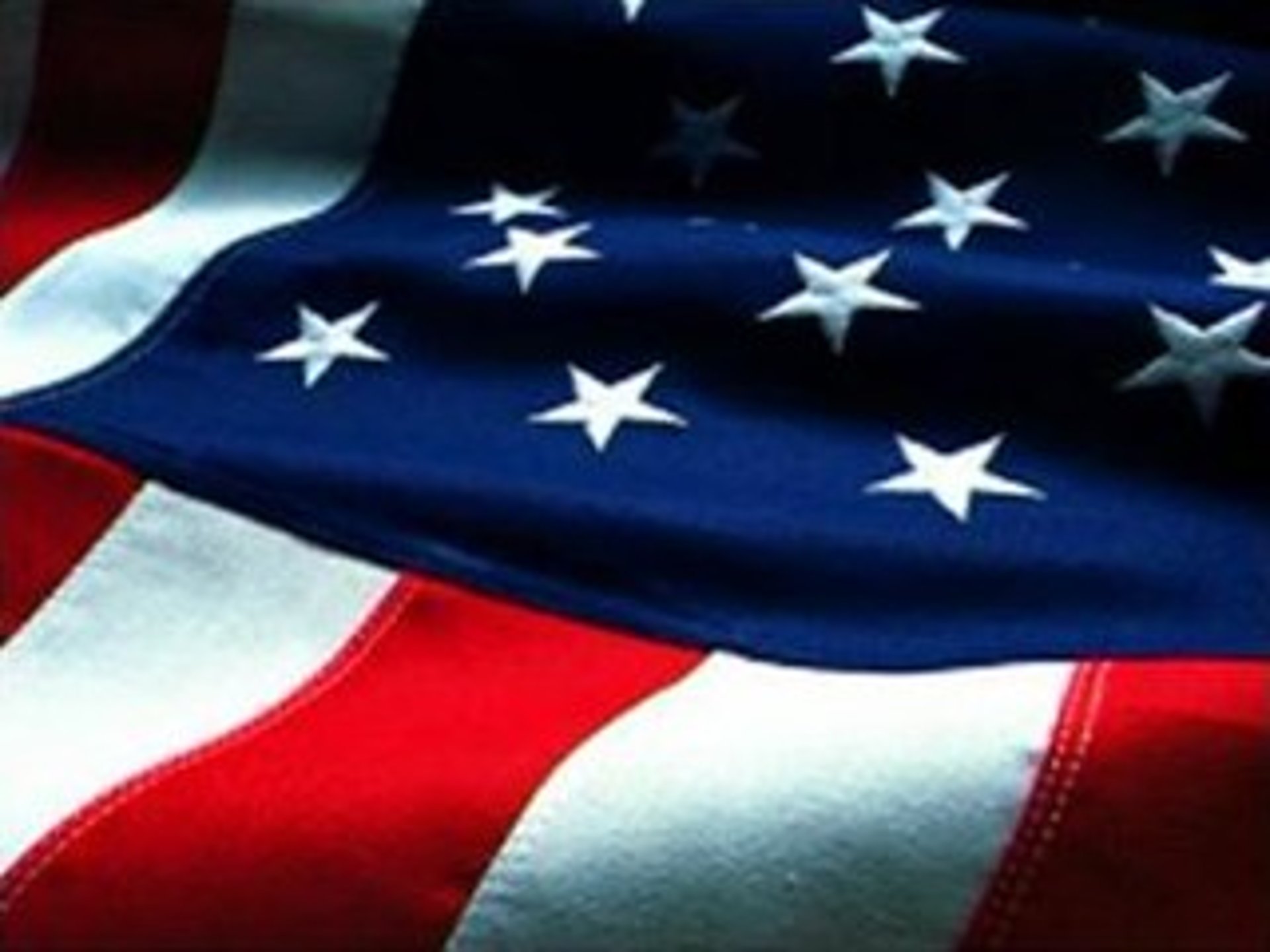 us a flag on white and red striped textile