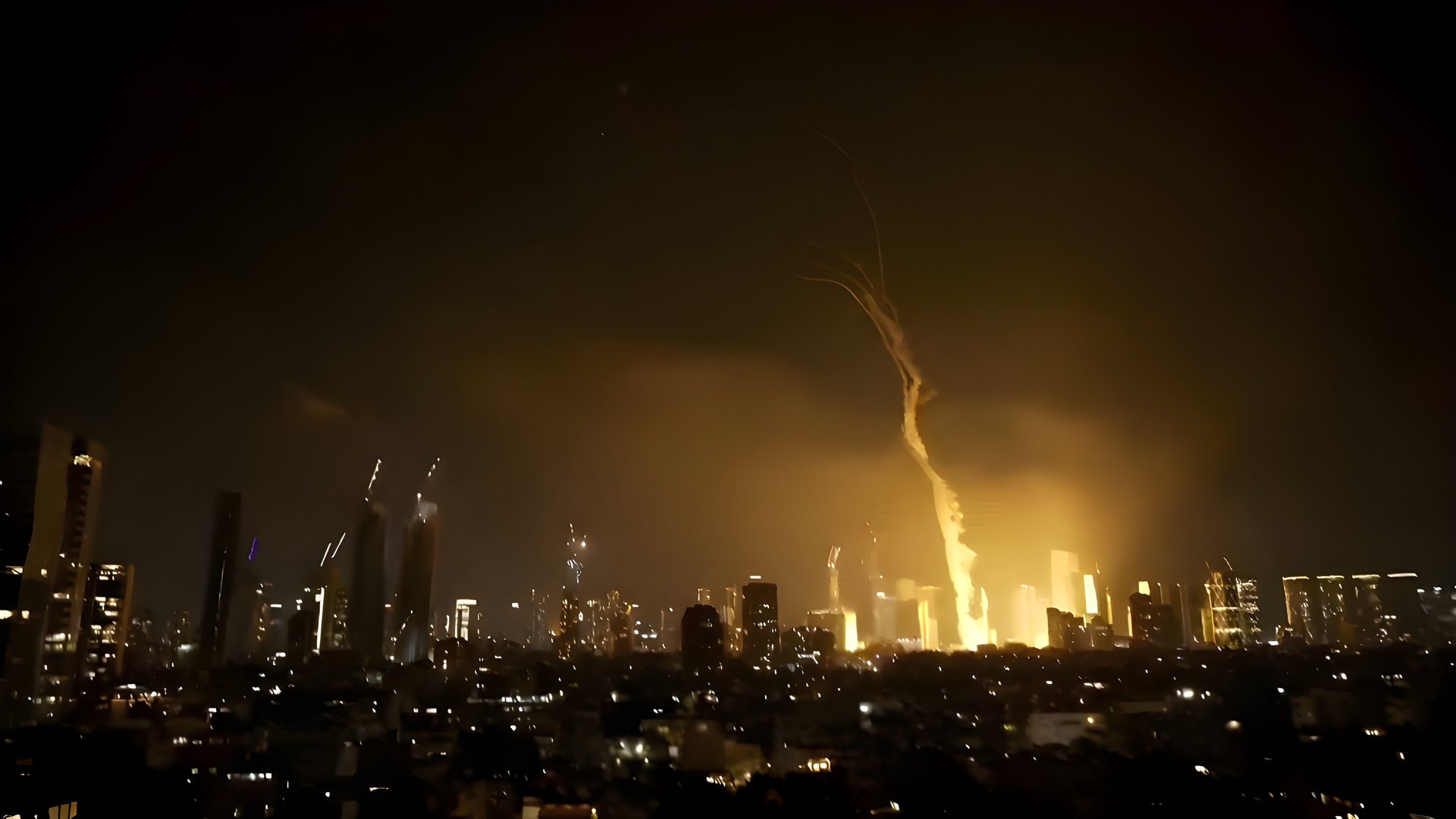 city skyline with lights turned on during night time