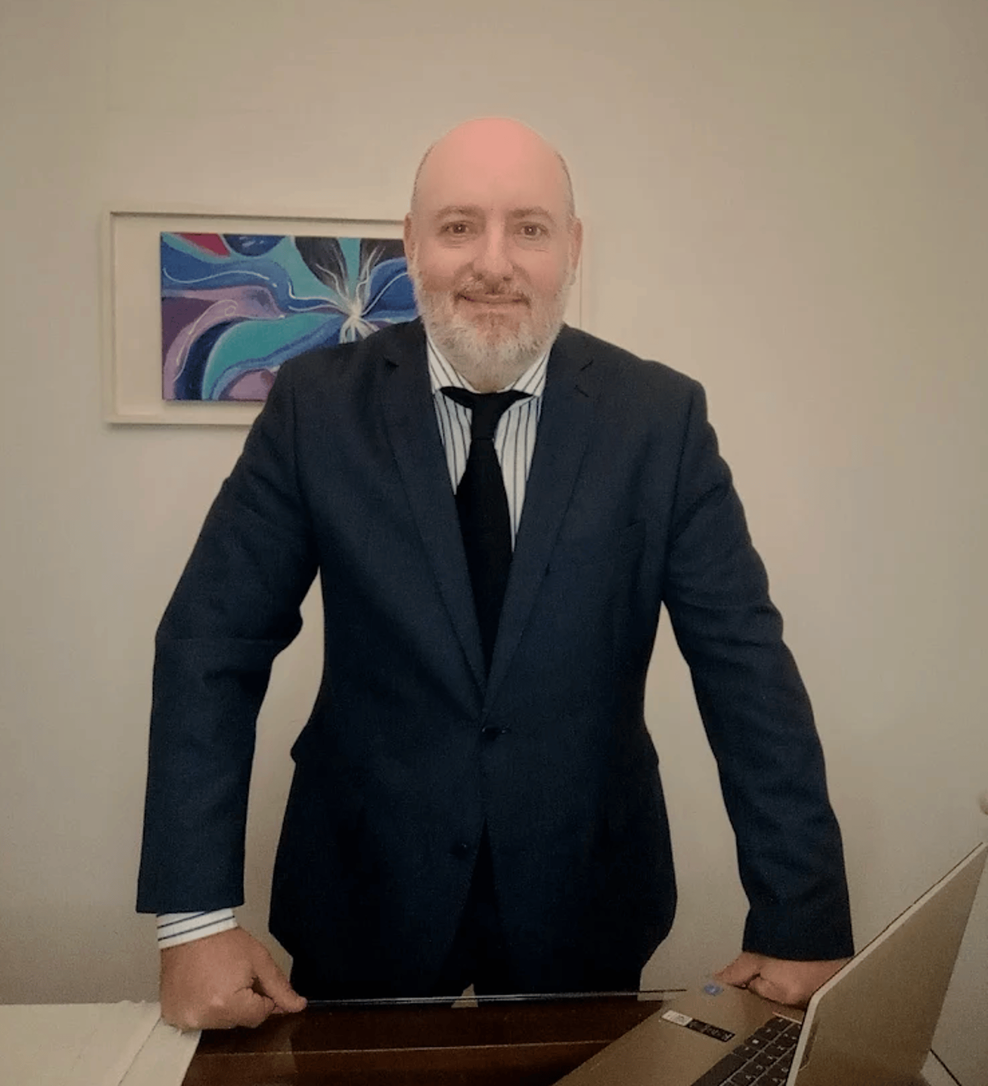 man writing on paper