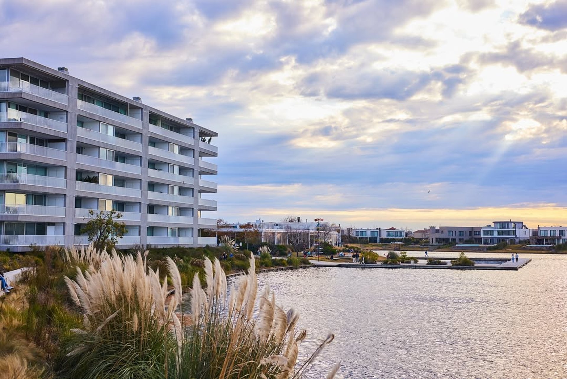 an abstract photo of a curved building with a blue sky in the background