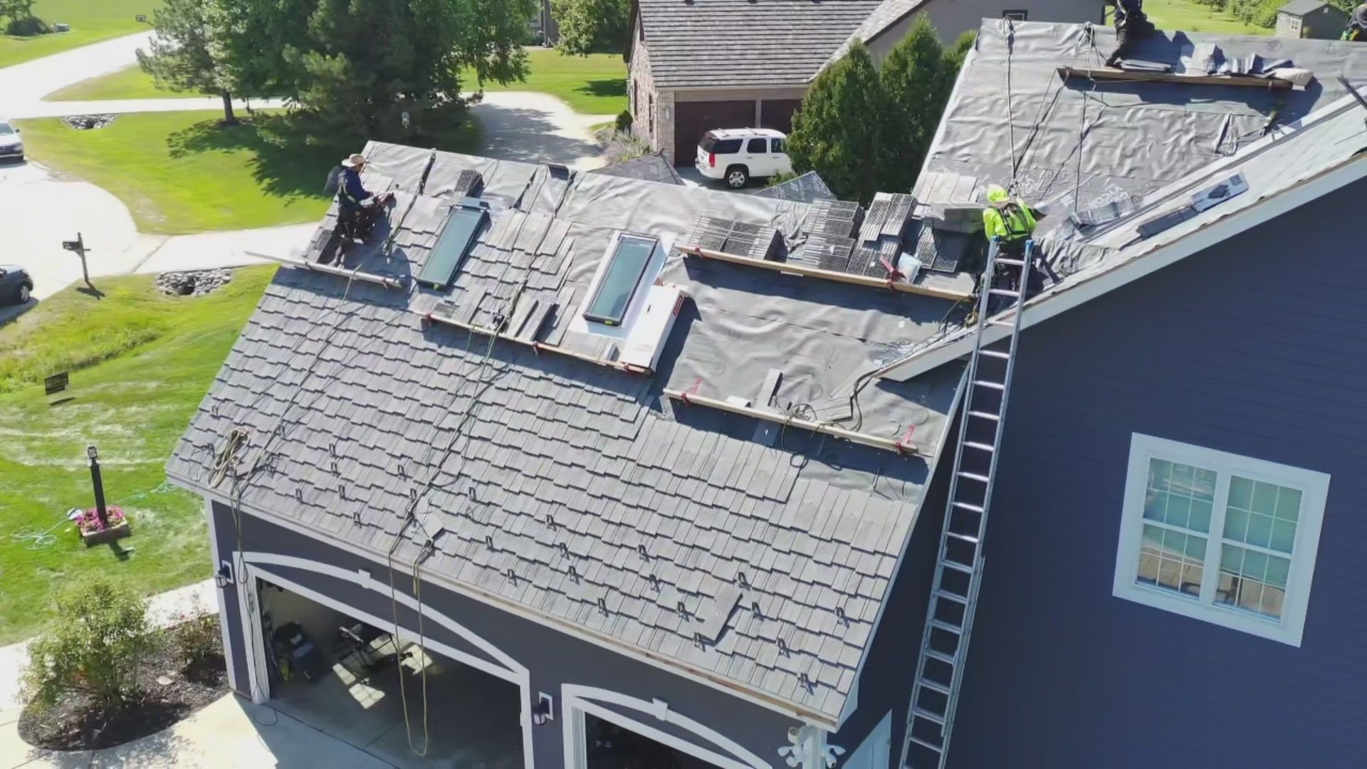 black and brown leather padded tub sofa