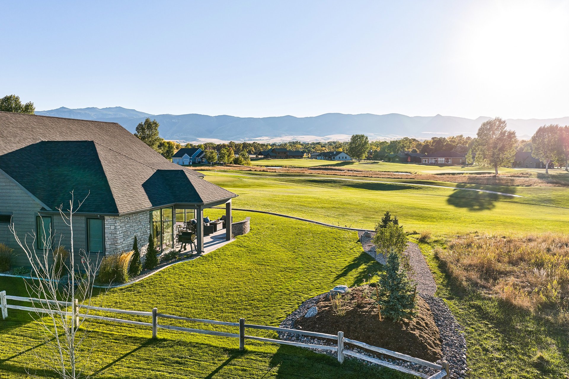 an abstract photo of a curved building with a blue sky in the background