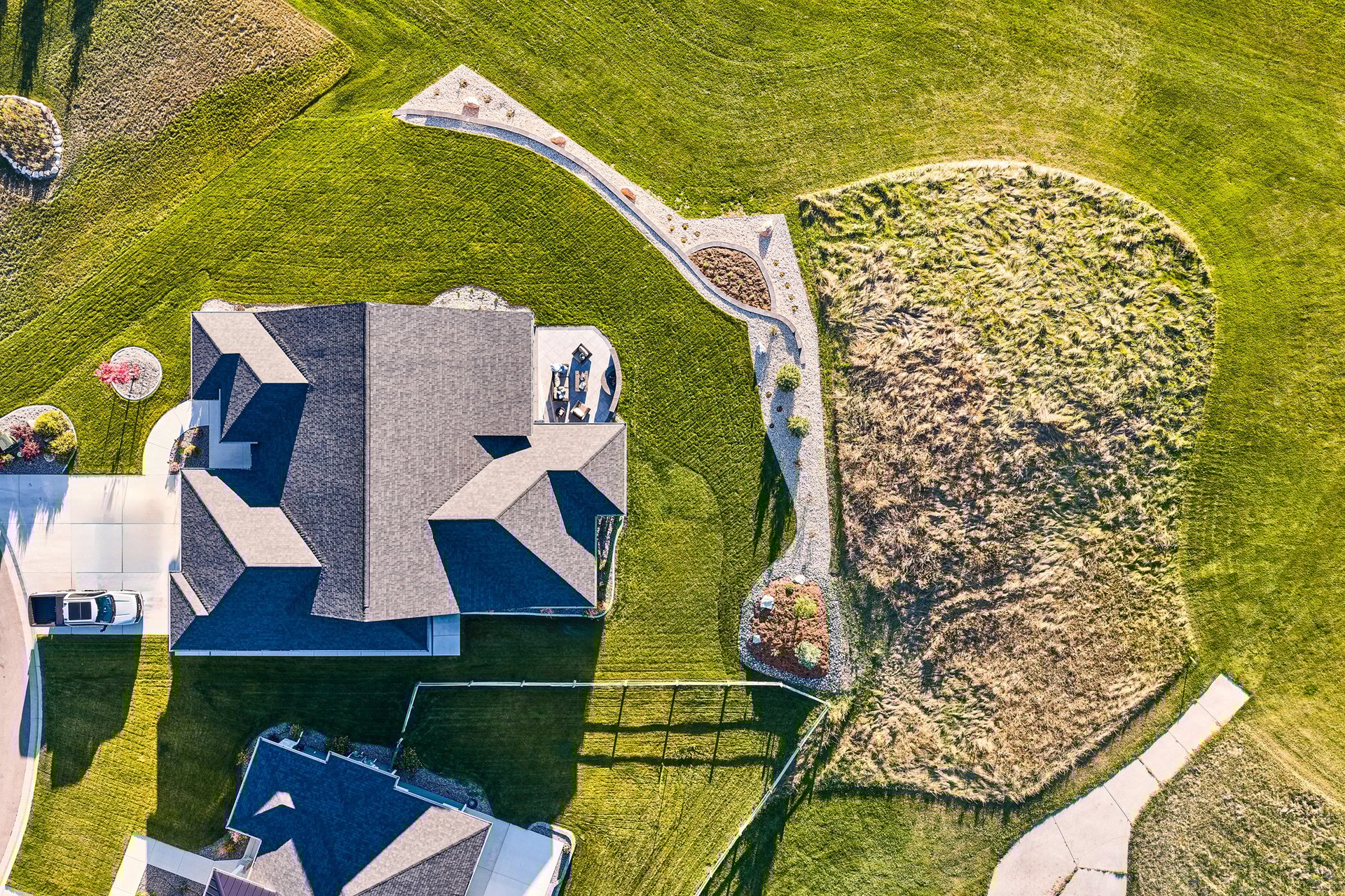 an abstract photo of a curved building with a blue sky in the background