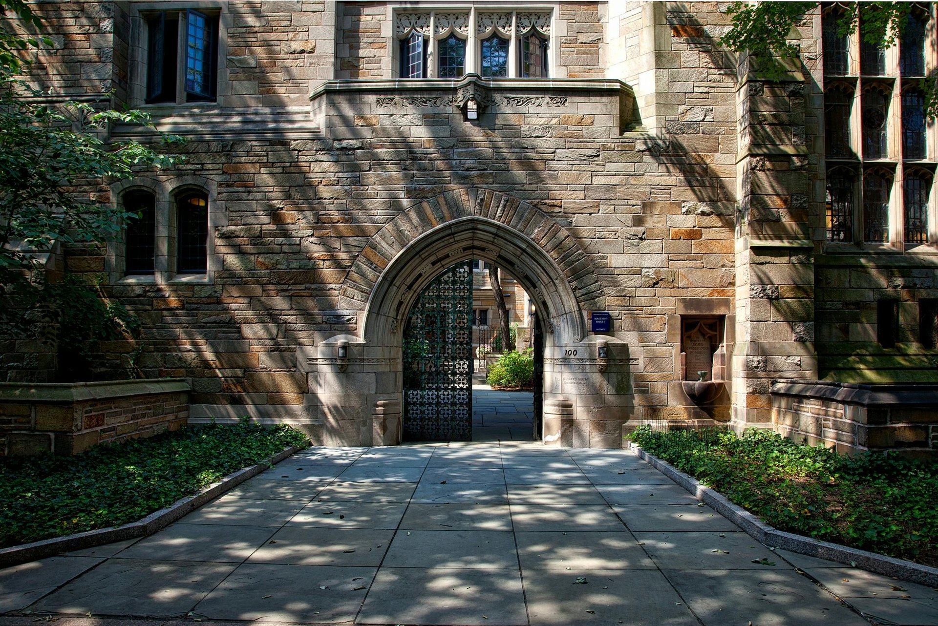 A person walks toward a university building.