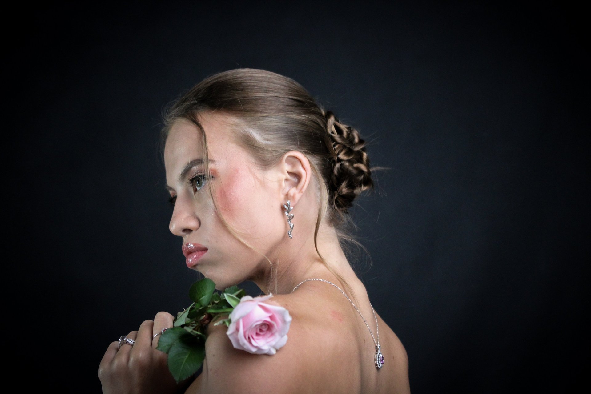 woman holding dried flower