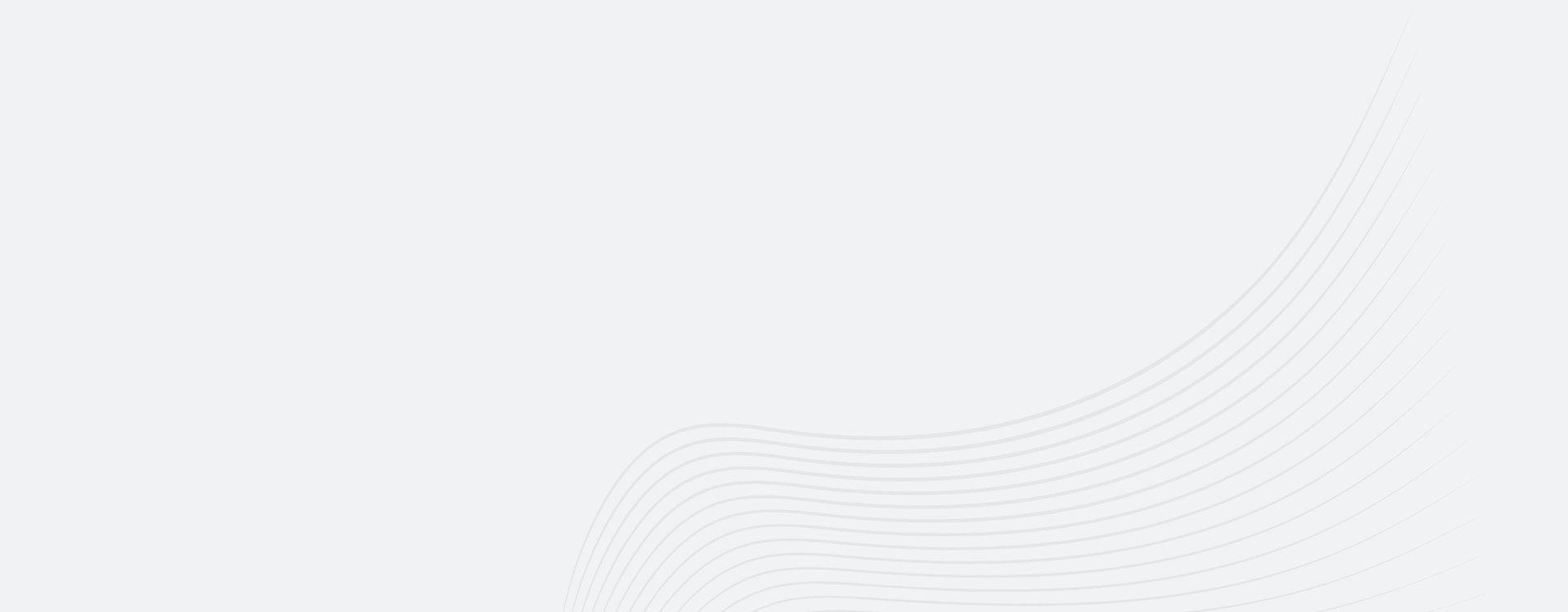 an abstract photo of a curved building with a blue sky in the background