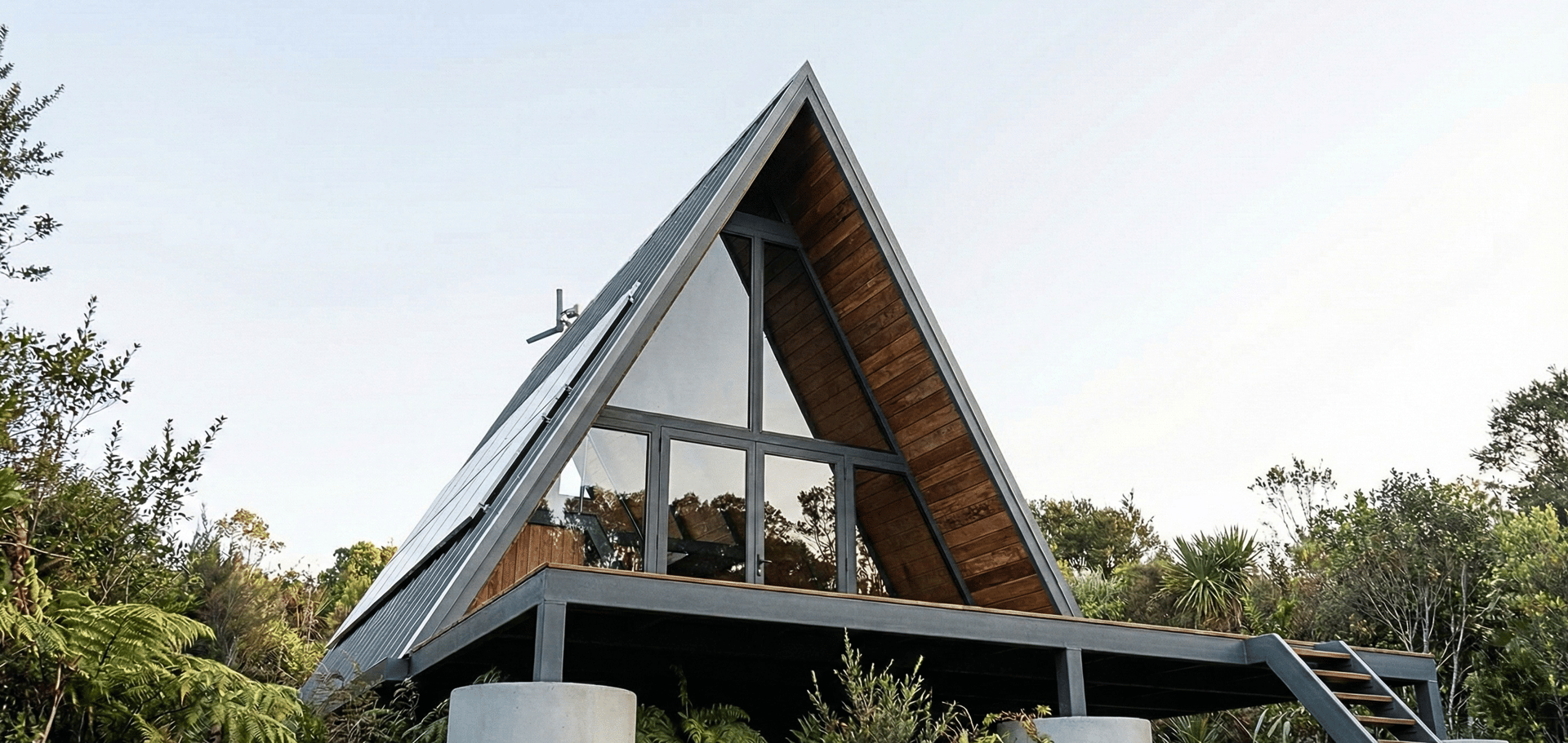 an abstract photo of a curved building with a blue sky in the background