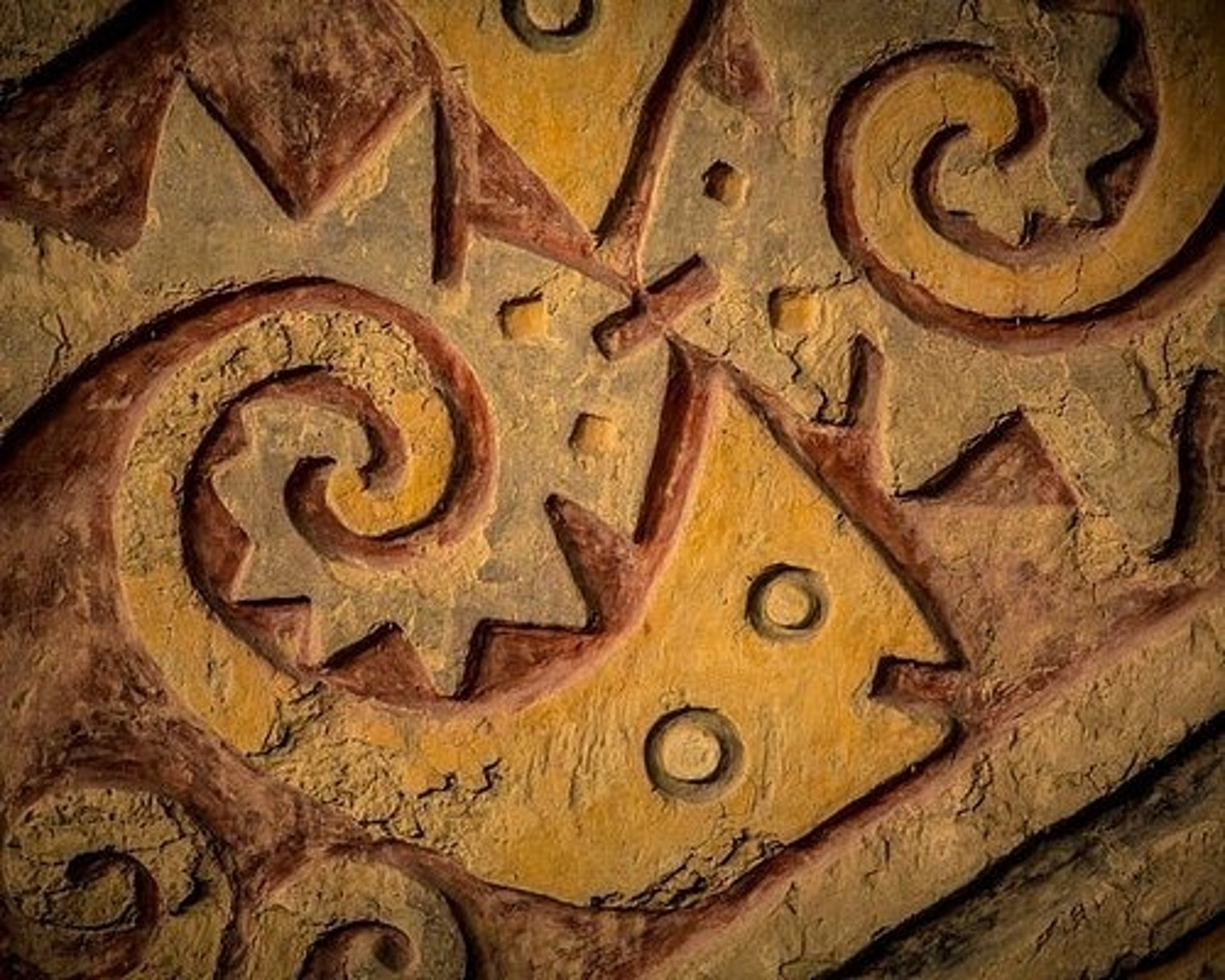 an abstract photo of a curved building with a blue sky in the background