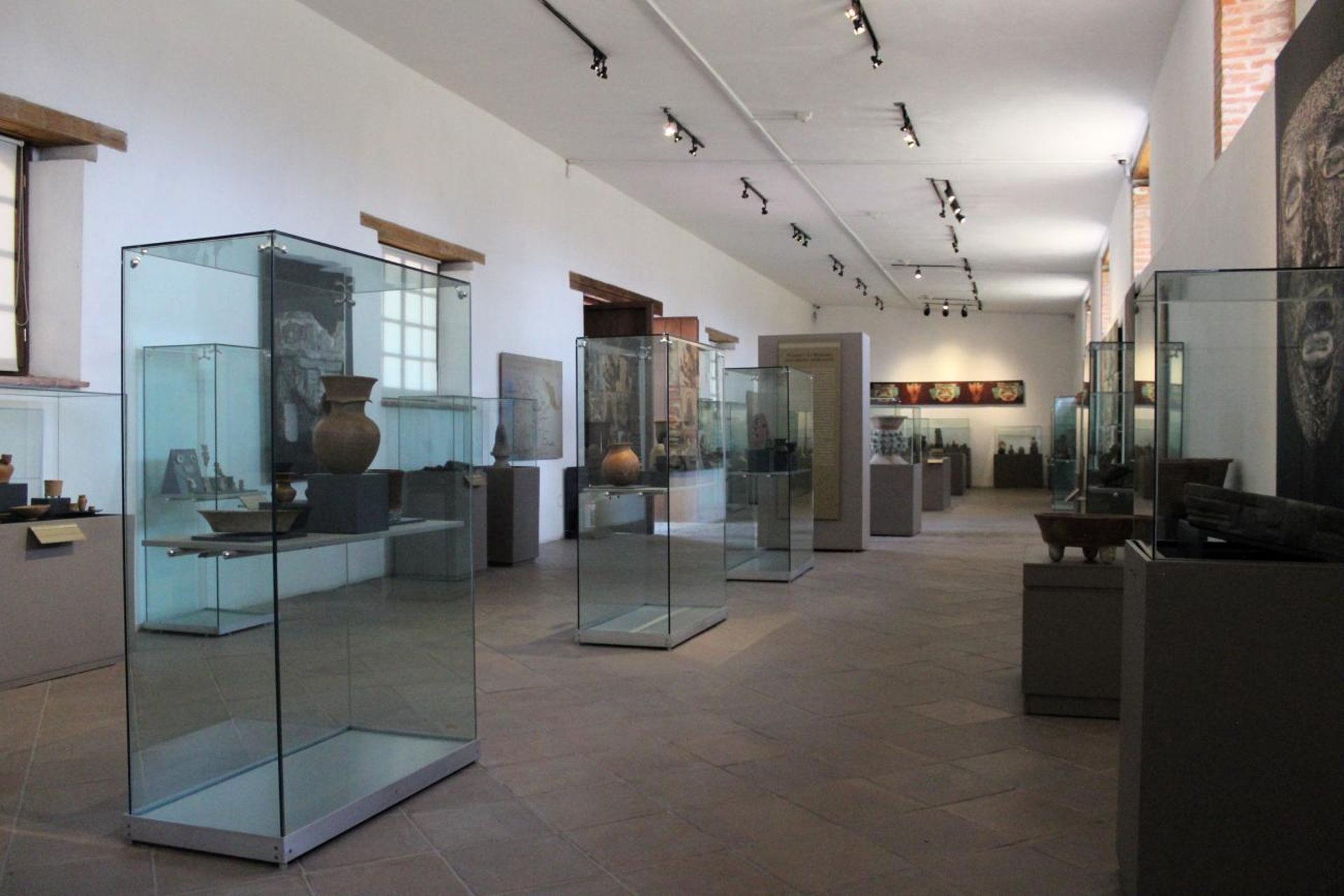 an abstract photo of a curved building with a blue sky in the background