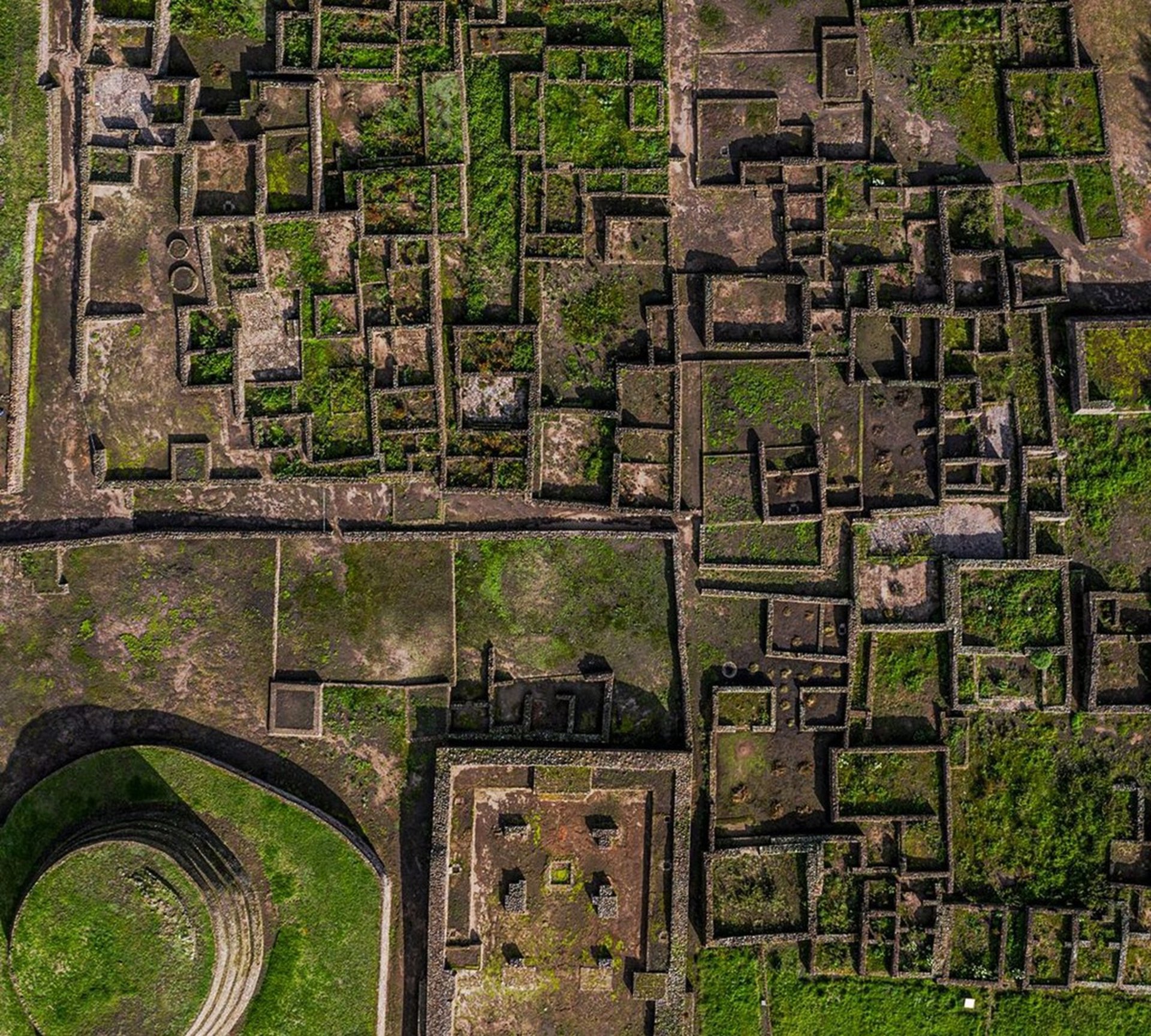 an abstract photo of a curved building with a blue sky in the background