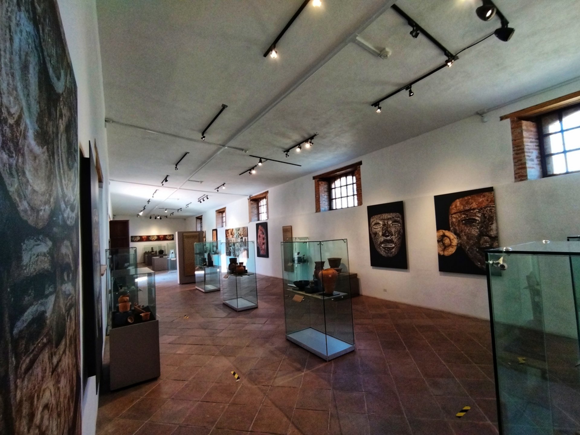 an abstract photo of a curved building with a blue sky in the background