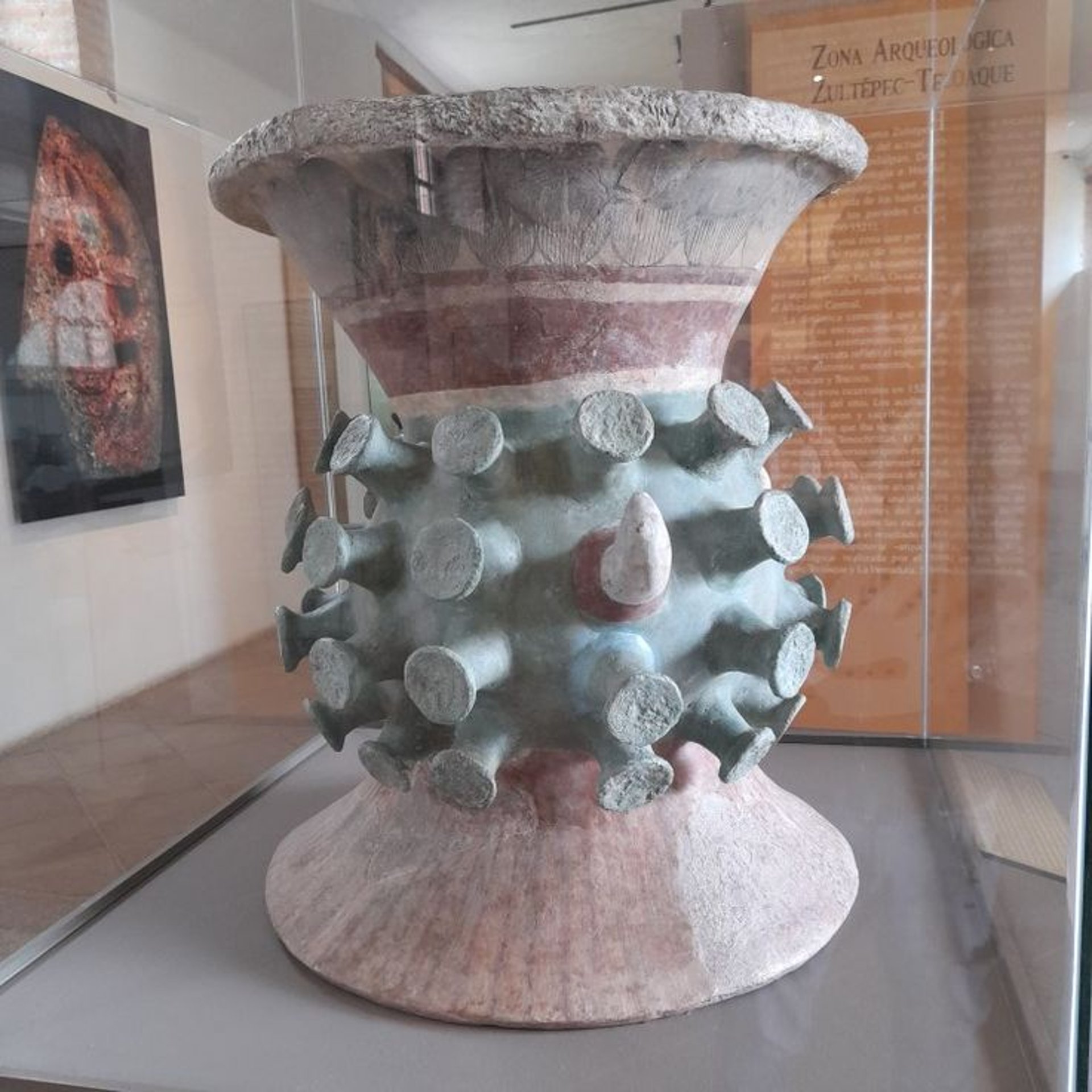 an abstract photo of a curved building with a blue sky in the background