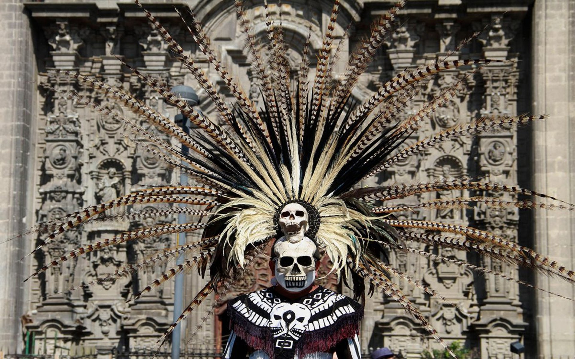 an abstract photo of a curved building with a blue sky in the background