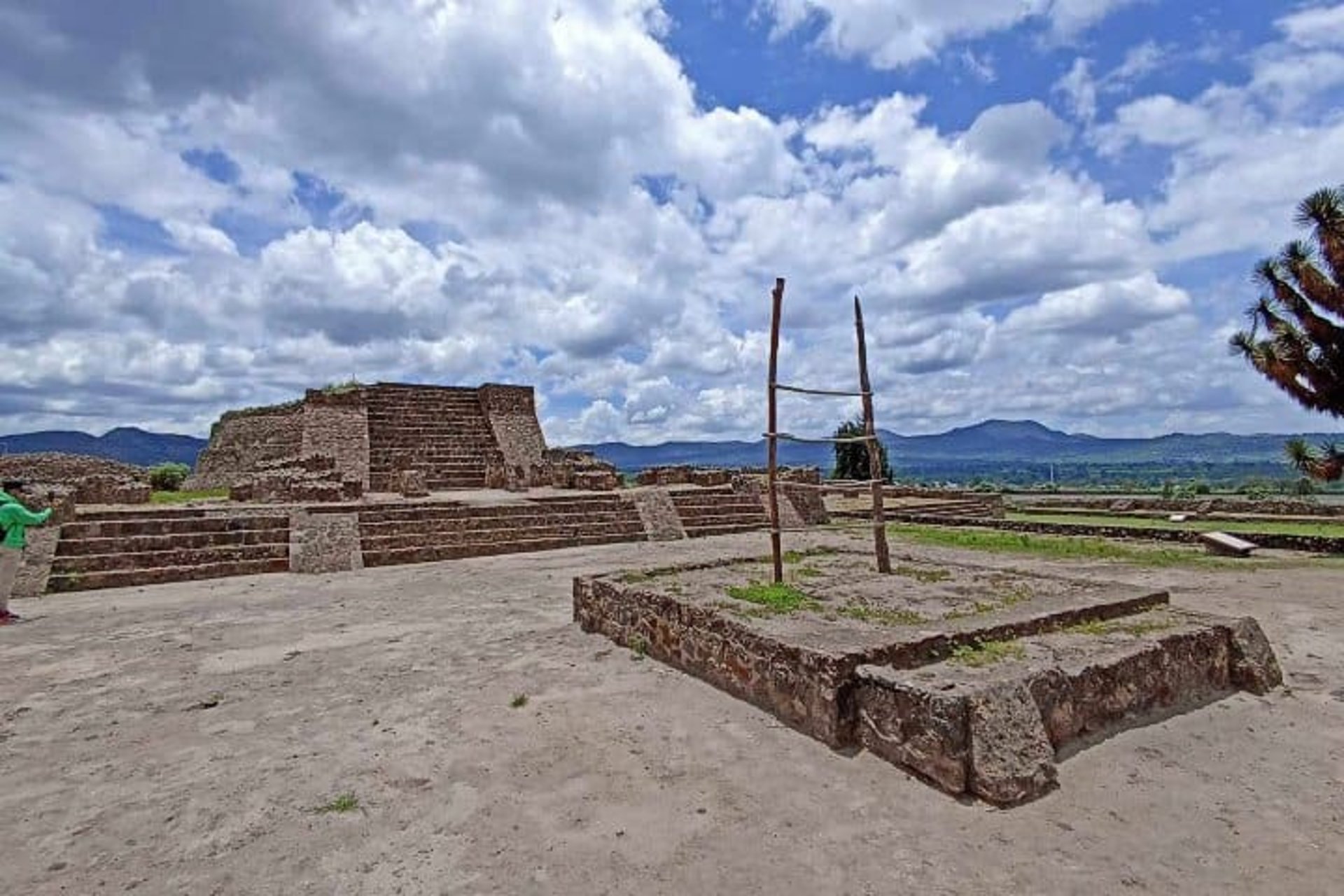 an abstract photo of a curved building with a blue sky in the background