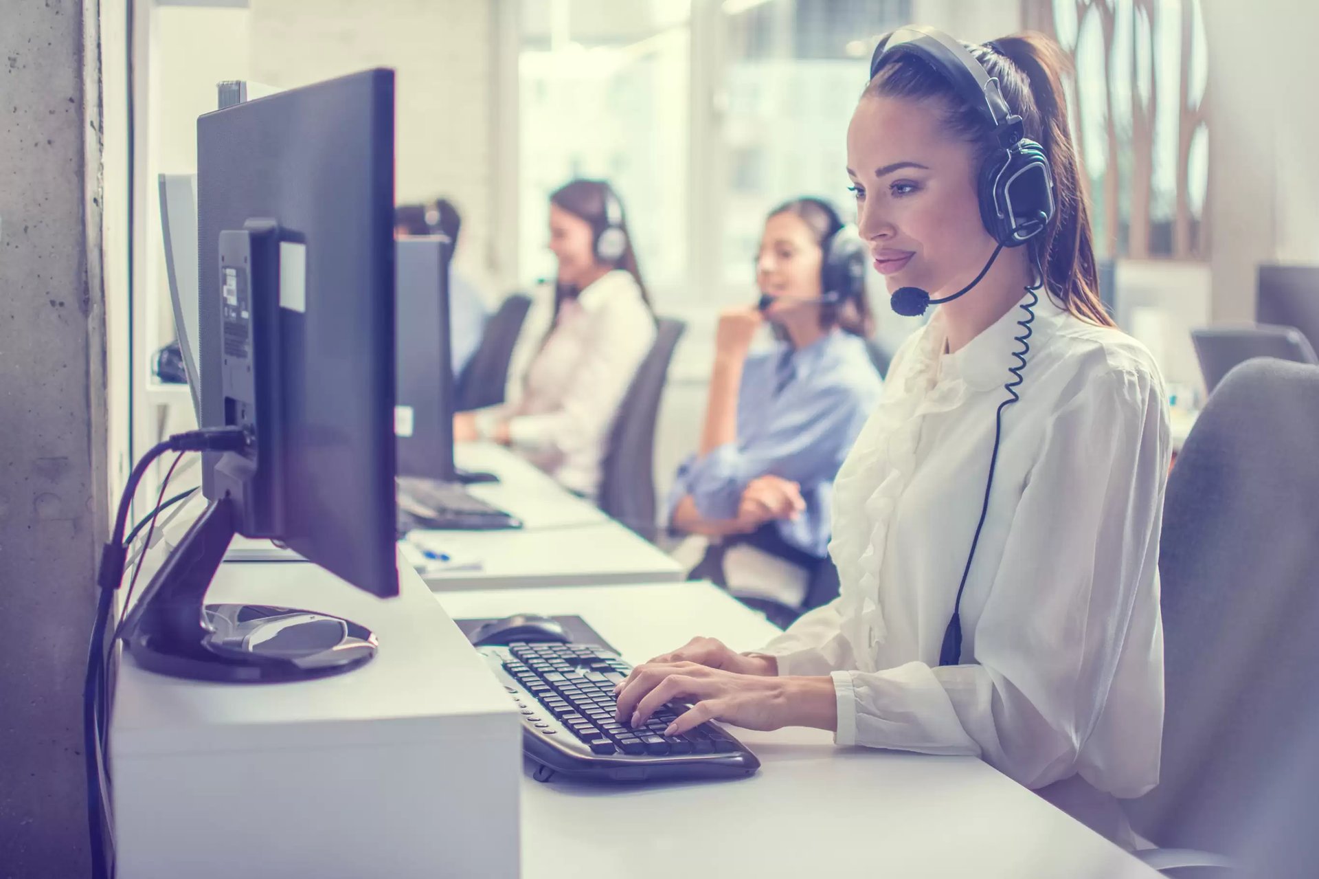an abstract photo of a curved building with a blue sky in the background