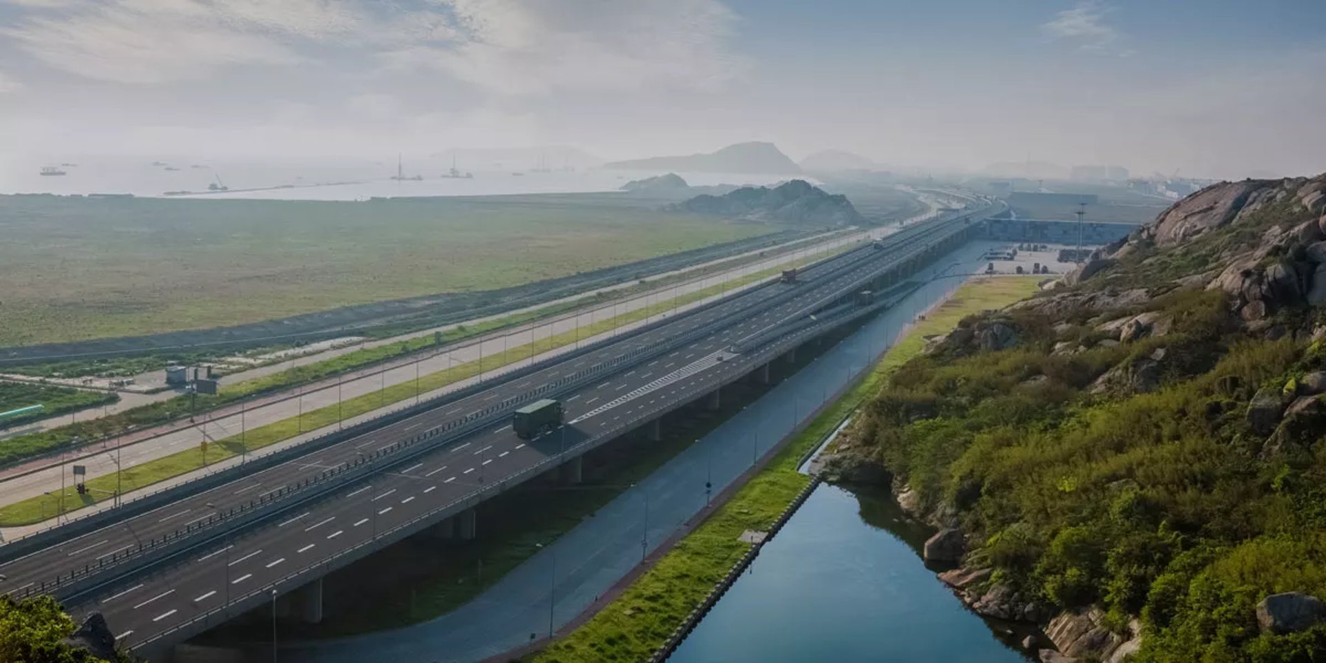 an abstract photo of a curved building with a blue sky in the background
