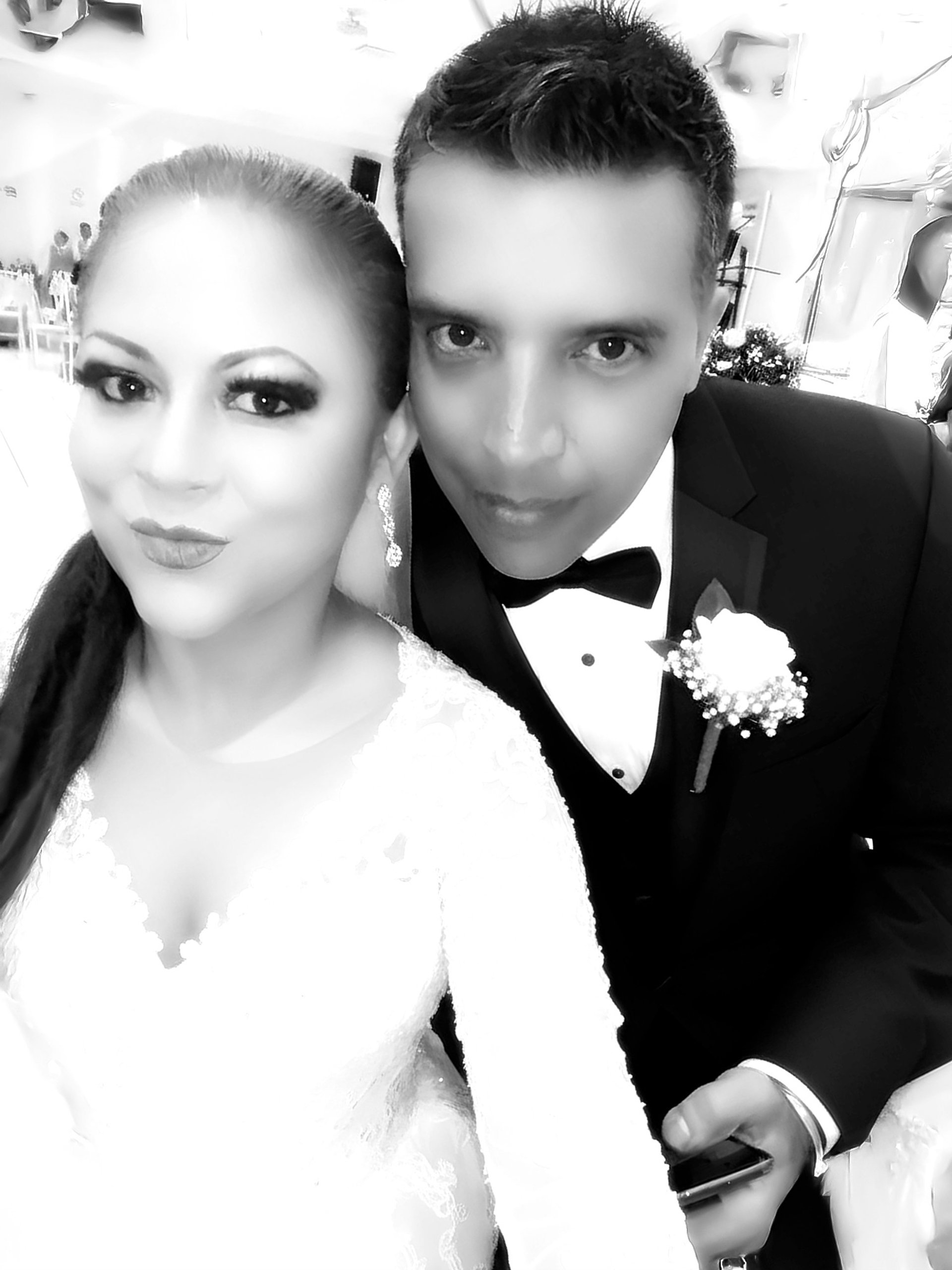 couple wearing silver-colored rings