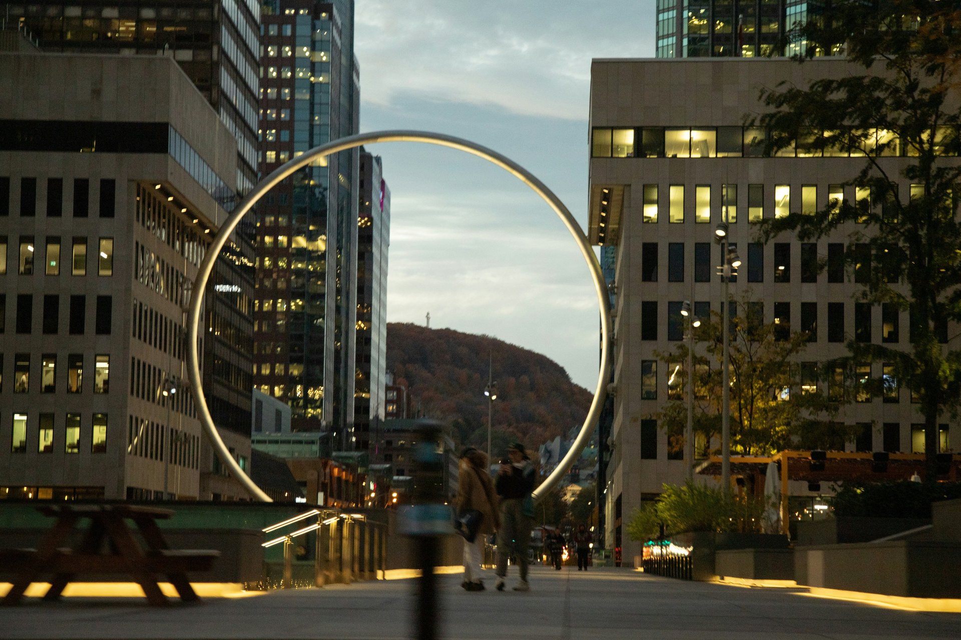 group of people sirring under sunset