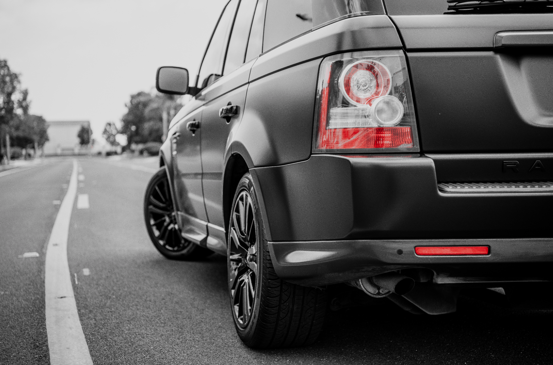 an abstract photo of a curved building with a blue sky in the background